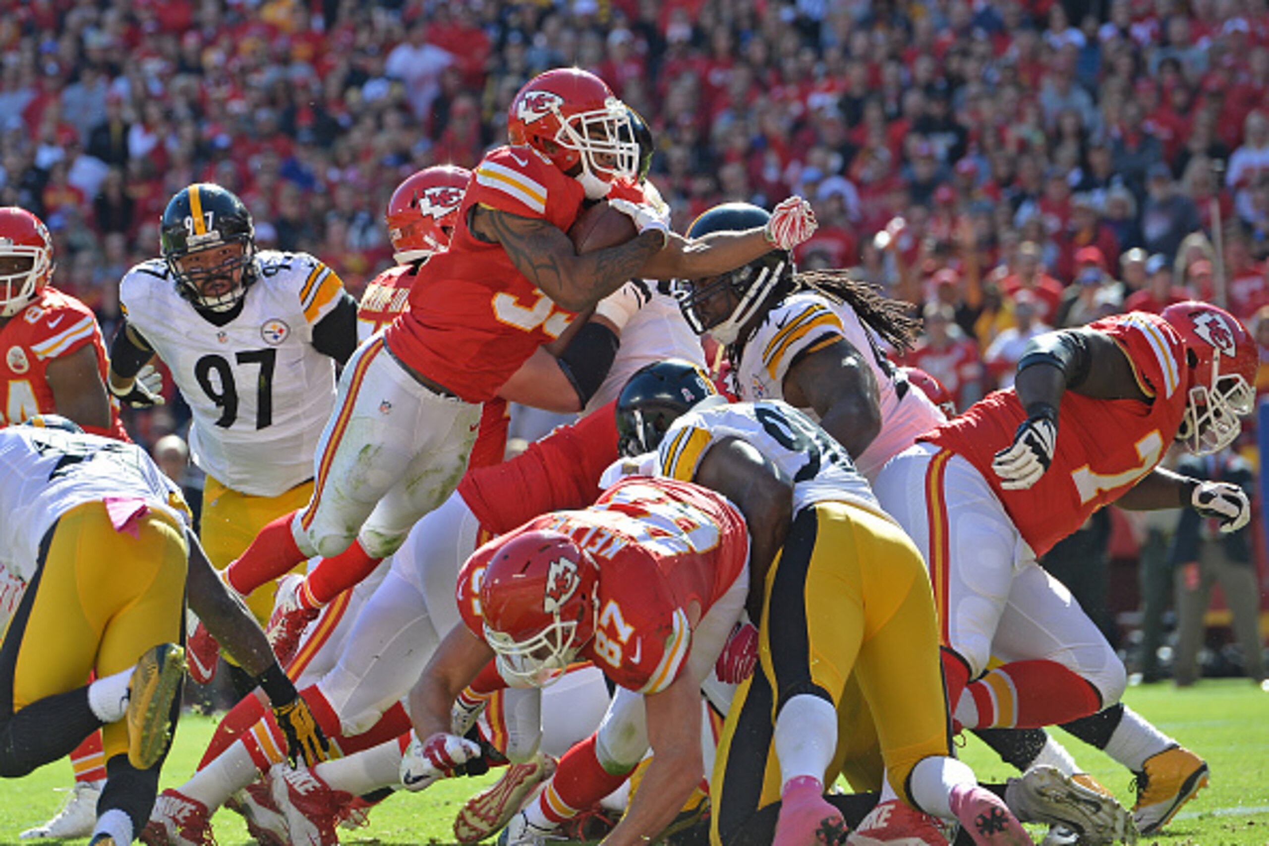 KANSAS CITY, MO - OCTOBER 25:  Running back Charcandrick West #35 of the Kansas City Chiefs dives over the Pittsburgh Steelers defense for a touchdown during the second half on October 25, 2015 at Arrowhead Stadium in Kansas City, Missouri.  (Photo by Pet