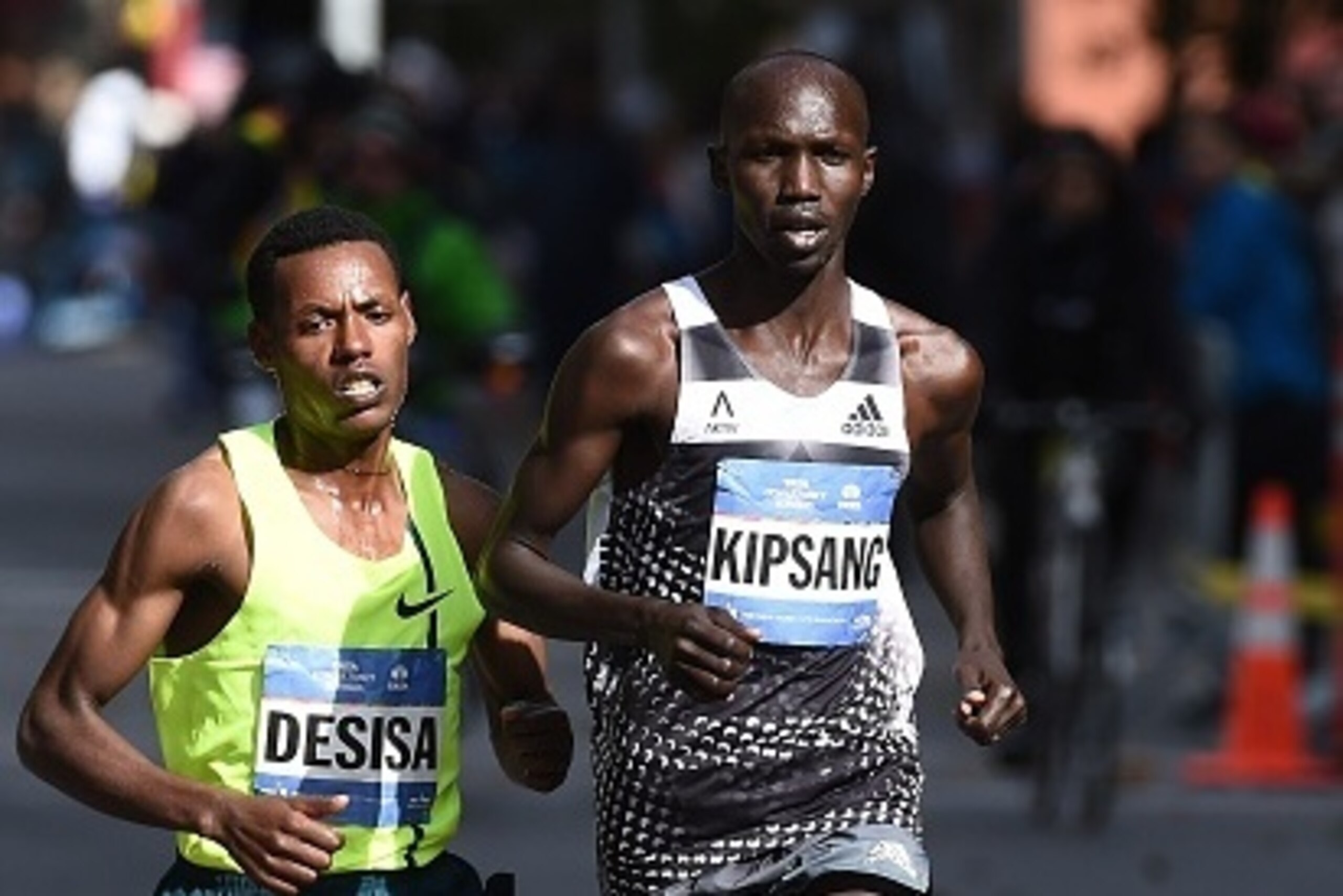 Kenya's Wilson Kipsang (R) runs past Ethiopia's Lelisa Desisa to win the New York City Marathon on November 2, 2014. Kipsang won the New York City Marathon men's title, defeating Ethiopia's Lelisa Desisa with a strong push to the finish line. Kipsang won 