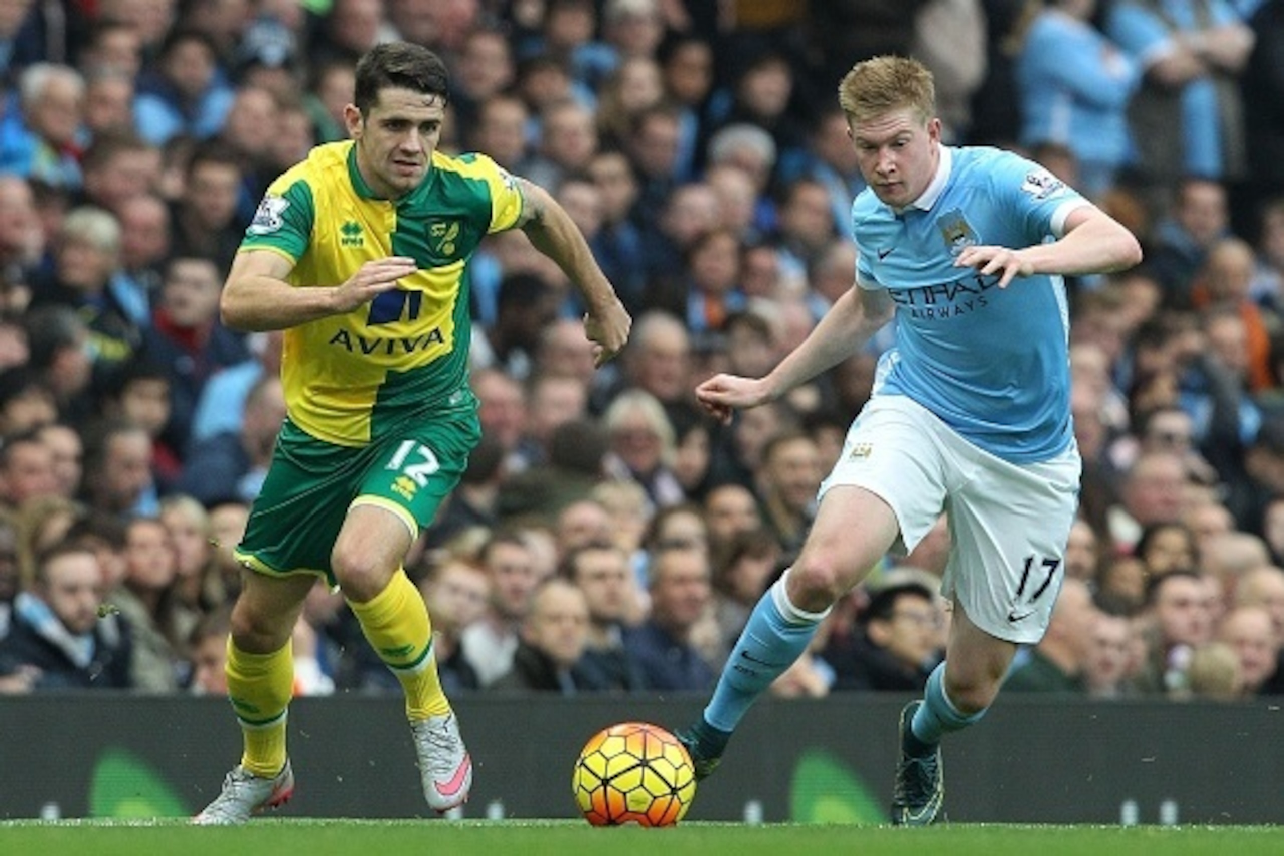 Norwich City's Irish midfielder Robbie Brady (L) vies with Manchester City's Belgian midfielder Kevin De Bruyne during the English Premier League football match between Manchester City and Norwich City at The Etihad Stadium in Manchester, north west Engla Norwich City's Irish midfielder Robbie Brady (L) vies with Manchester City's Belgian midfielder Kevin De Bruyne during the English Premier League football match between Manchester City and Norwich City at The Etihad Stadium in Manchester, north west Engla
