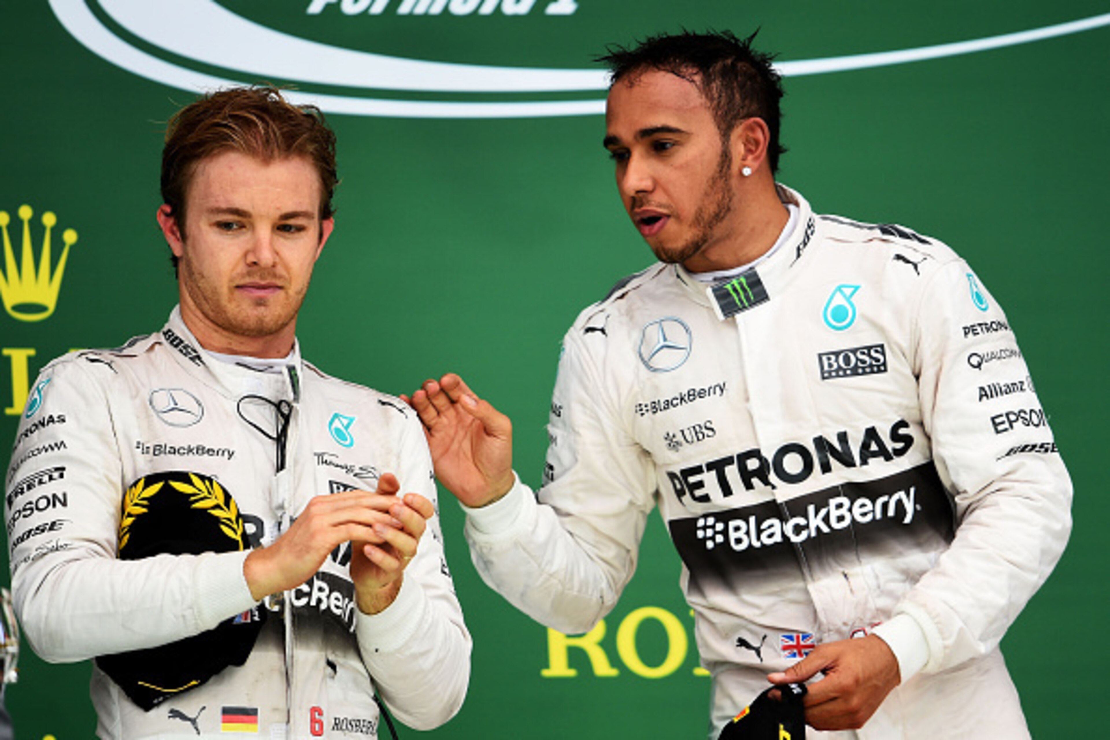 AUSTIN, TX - OCTOBER 25:  Lewis Hamilton of Great Britain and Mercedes GP celebrates on the podium next to Nico Rosberg of Germany and Mercedes GP after winning the United States Formula One Grand Prix and the championship at Circuit of The Americas on Oc