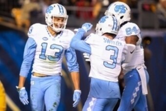 Oct 29, 2015; Pittsburgh, PA, USA; North Carolina Tar Heels wide receiver Mack Hollins (13) reacts after scoring  on a thirty-two yard touchdown pass with teammates wide receiver Ryan Switzer (3) and wide receiver Bug Howard (84) against the Pittsburgh Pa