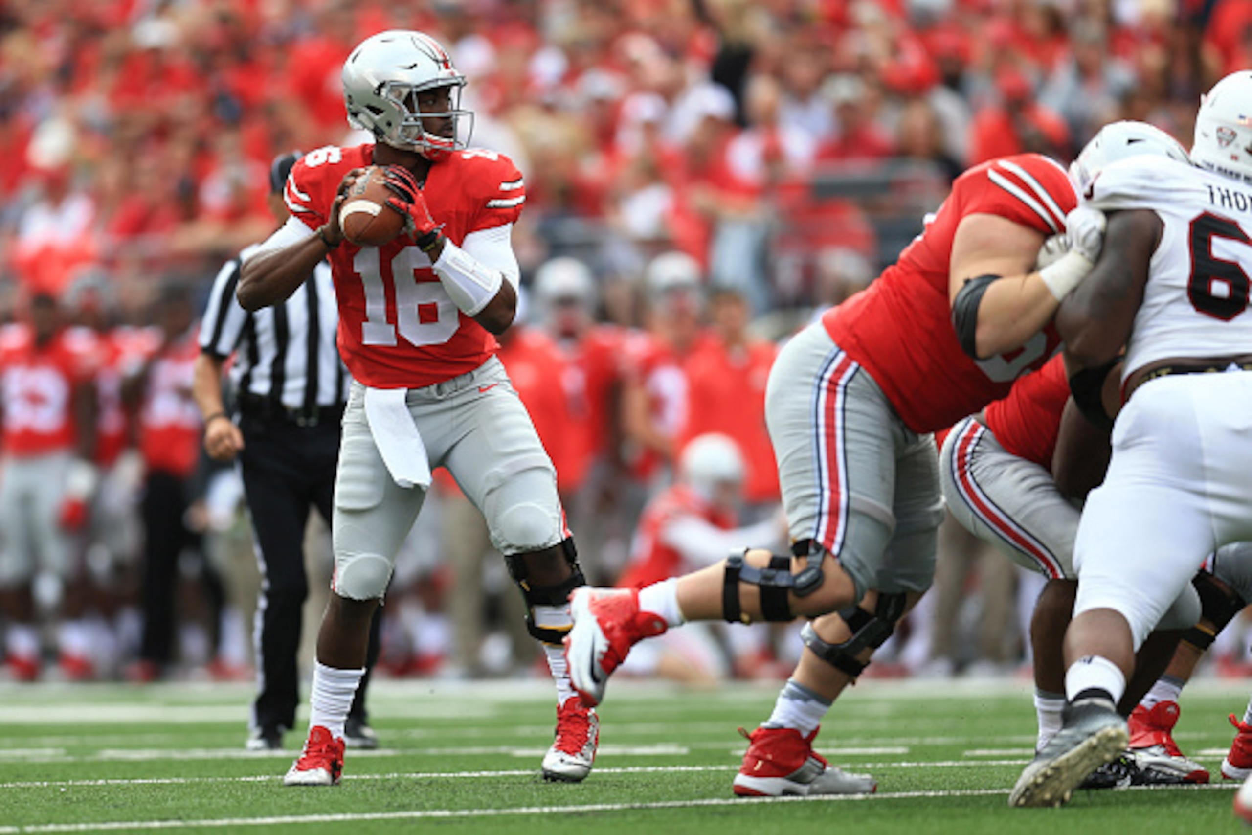 COLUMBUS, OH - SEPTEMBER 19: Quarterback J.T. Barrett #16 of the Ohio State Buckeyes against the Northern Illinois Huskies at Ohio Stadium on September 19, 2015 in Columbus, Ohio.  (Photo by Andrew Weber/Getty Images)