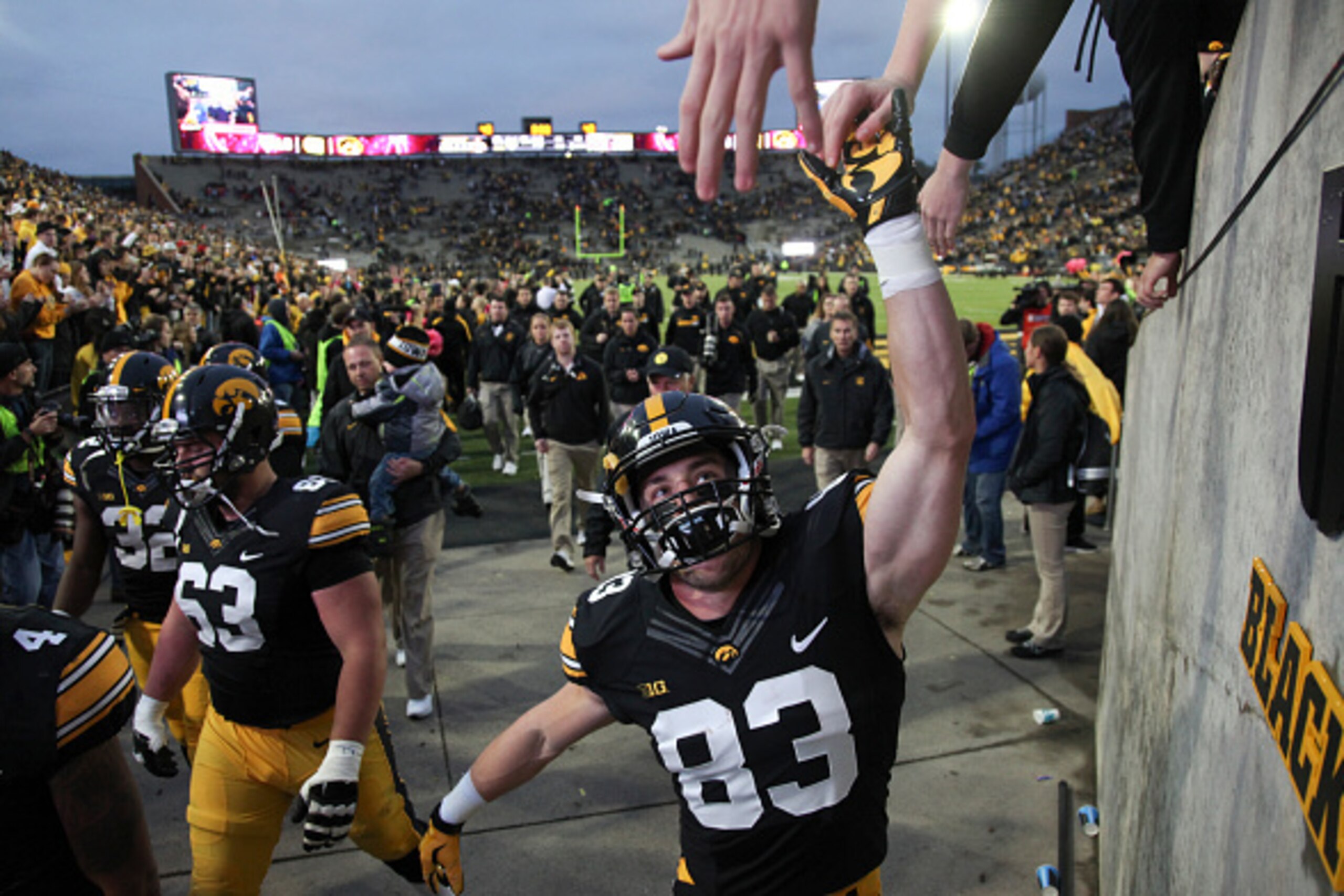 IOWA CITY, IA - OCTOBER 31:  Wide receiver Riley McCarron #83 of the Iowa Hawkeyes celebrates with fans after the match-up against the Maryland Terrapins on October 31, 2015 at Kinnick Stadium, in Iowa City, Iowa.  (Photo by Matthew Holst/Getty Images)
