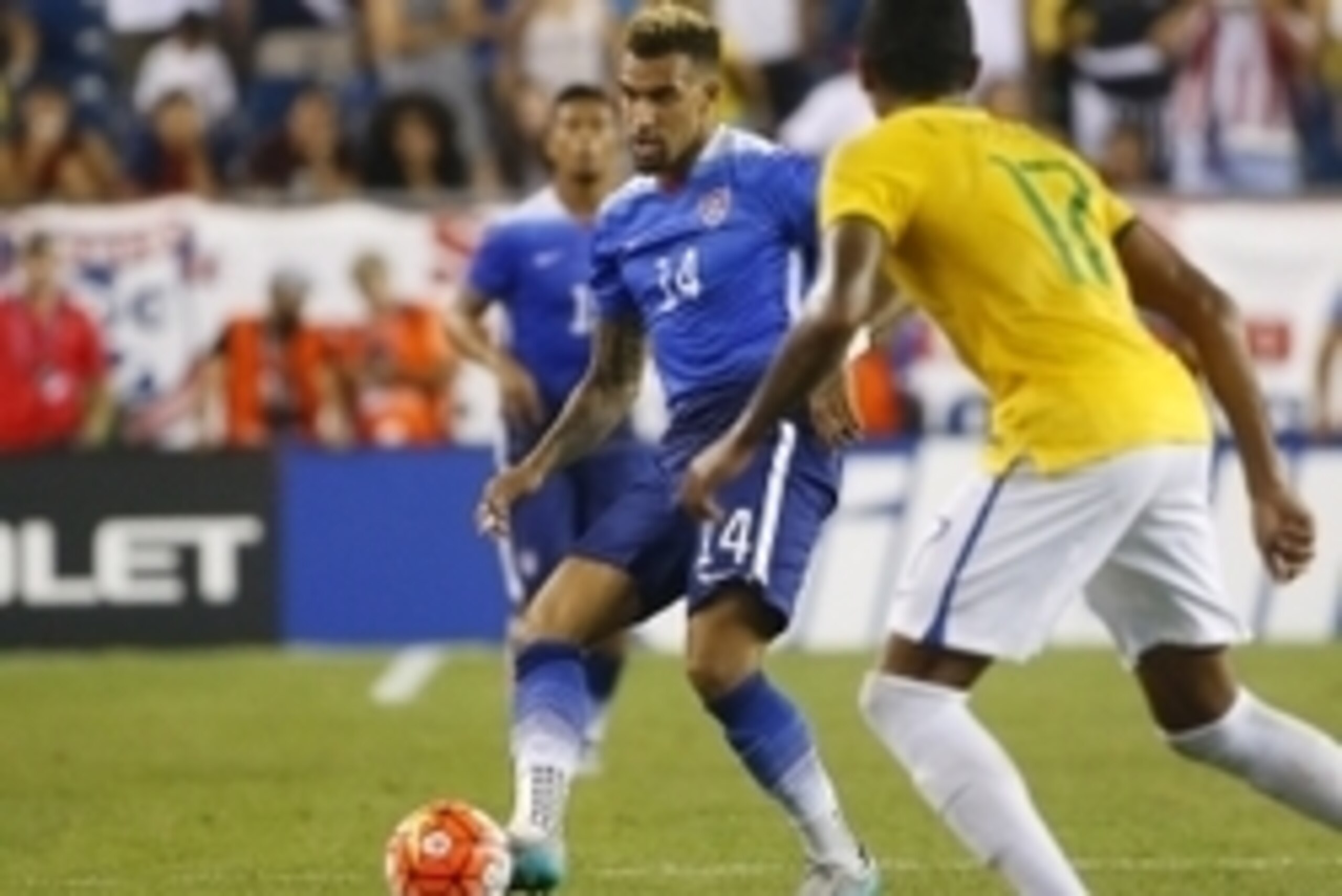 Sep 8, 2015; Foxborough, Mass, USA; United States midfielder Danny Williams (14) passes the ball past Brazil midfielder Luiz Gustavo (17) during the first half at Gillette Stadium. Mandatory Credit: Winslow Townson-USA TODAY Sports