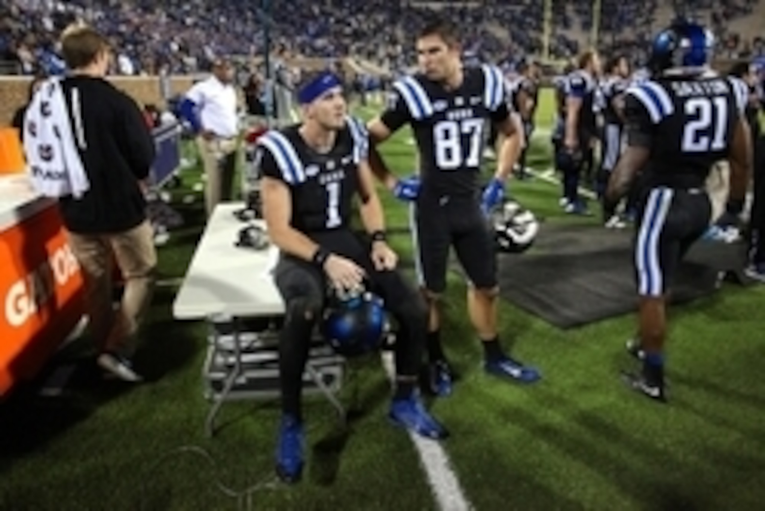 Oct 31, 2015; Durham, NC, USA; Duke Blue Devils quarterback Thomas Sirk (1) and wide receiver Max McCaffrey (87) watch the monitor as officials try to decide the end of the game Miami Hurricanes touchdown in the closing seconds of their game at Wallace Wa