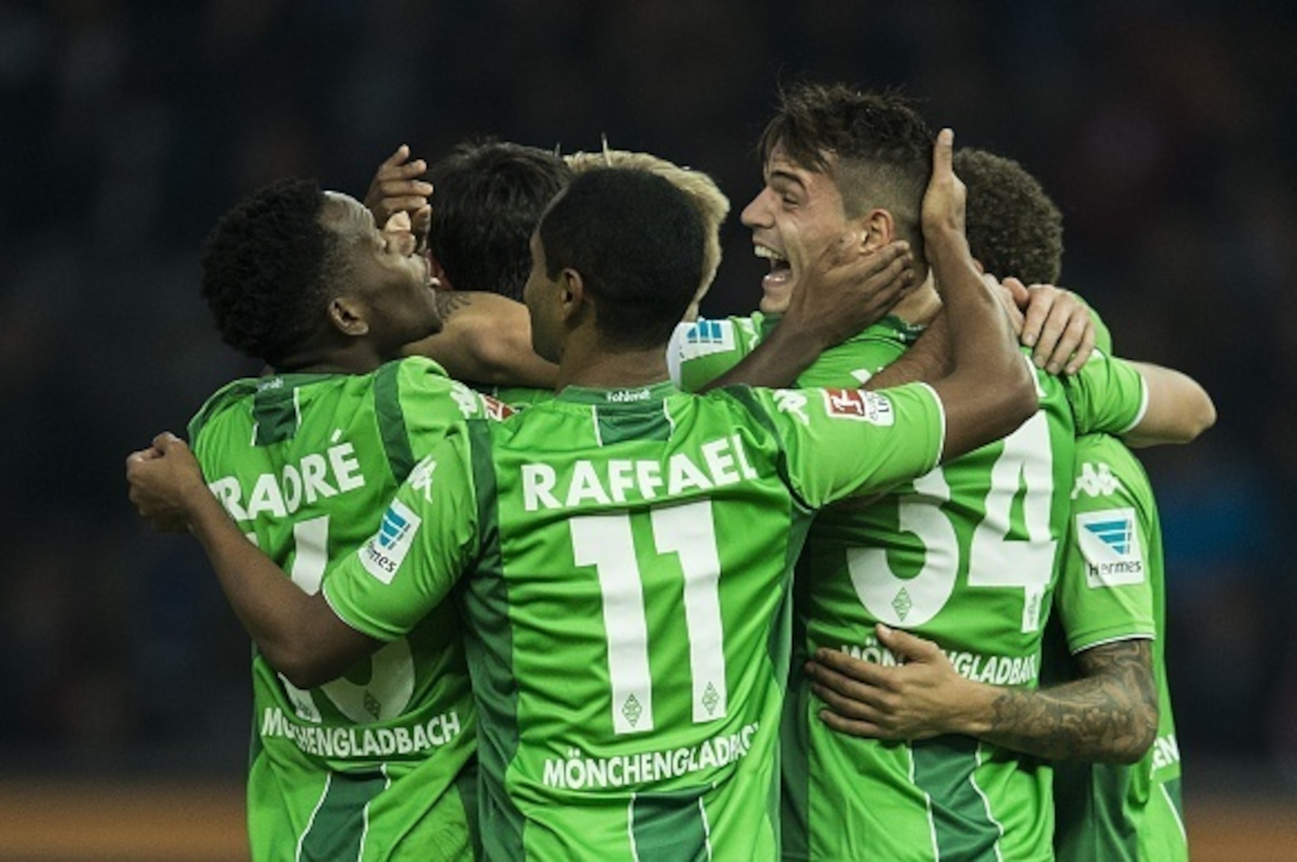 Moenchengladbach's Swiss midfielder Granit Xhaka ( R), Brazilian midfielder Raffael (C) and Guinean midfielder Ibrahima Traore (L) celebrate scoring the third goal on a penalty during the German first division Bundesliga football match Hertha Berlin vs B Moenchengladbach's Swiss midfielder Granit Xhaka ( R), Brazilian midfielder Raffael (C) and Guinean midfielder Ibrahima Traore (L) celebrate scoring the third goal on a penalty during the German first division Bundesliga football match Hertha Berlin vs B