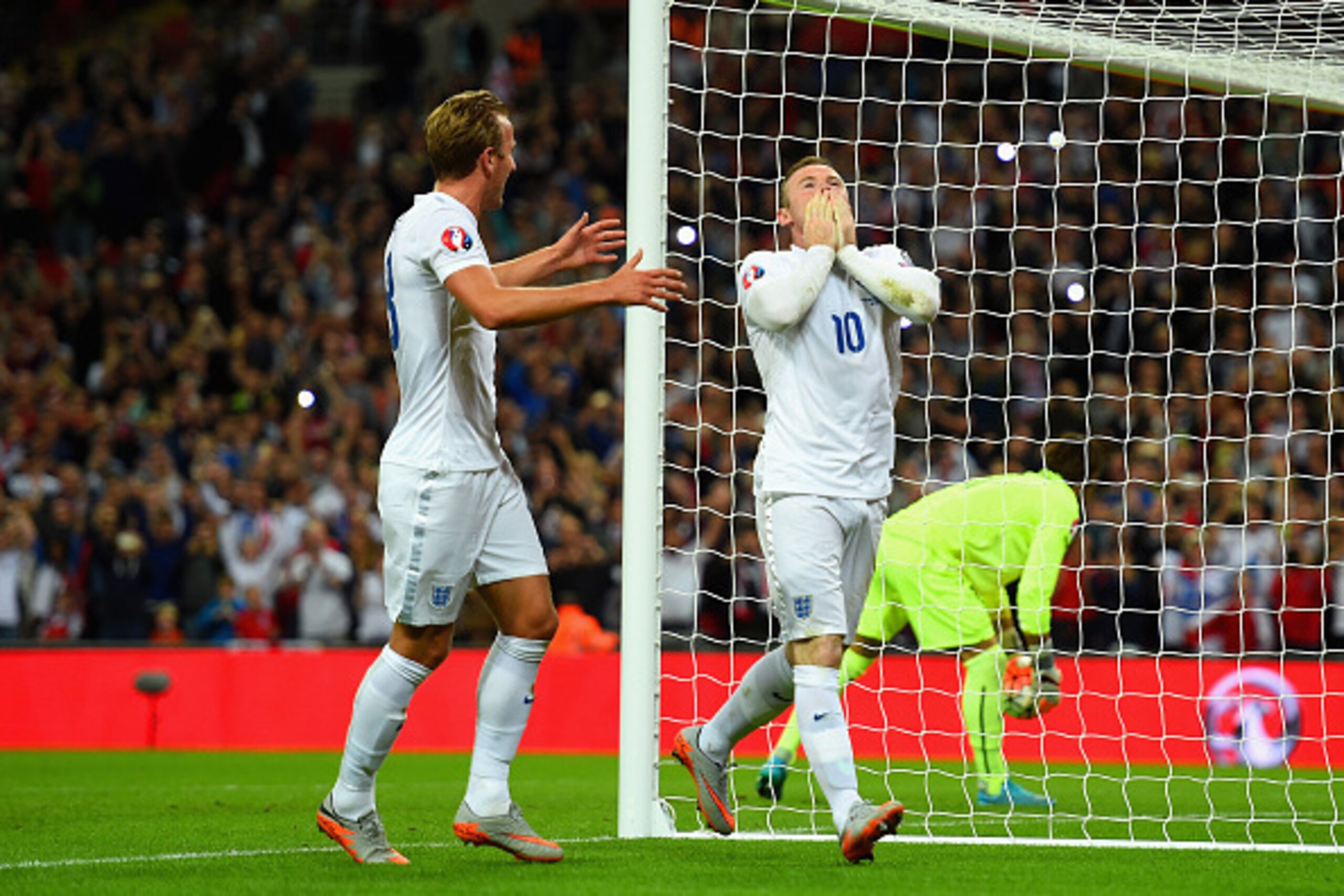 LONDON, ENGLAND - SEPTEMBER 08:  Wayne Rooney of England celebrates scoring their second goal from the penalty spot with Harry Kane of England during the UEFA EURO 2016 Group E qualifying match between England and Switzerland at Wembley Stadium on Septemb