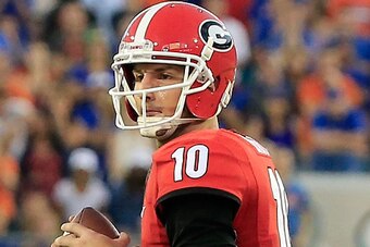 JACKSONVILLE, FL - OCTOBER 31:  Faton Bauta #10 of the Georgia Bulldogs attempts a pass during the game against the Florida Gators at EverBank Field on October 31, 2015 in Jacksonville, Florida.  (Photo by Sam Greenwood/Getty Images)