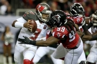 Nov 1, 2015; Atlanta, GA, USA; Tampa Bay Buccaneers quarterback Jameis Winston (3) is hit by Atlanta Falcons defensive end Adrian Clayborn (99) but prevents the tackle from Clayborn in the first quarter of their game at the Georgia Dome. Mandatory Credit: