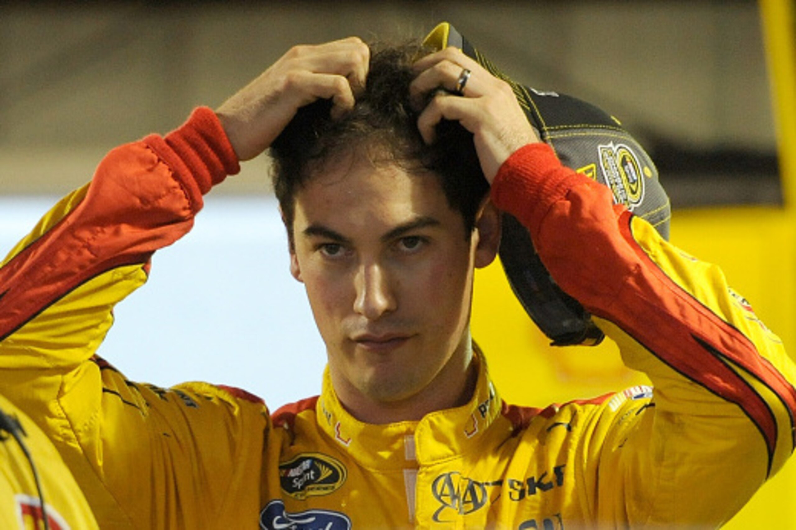MARTINSVILLE, VA - NOVEMBER 01:  Joey Logano, driver of the #22 Shell Pennzoil Ford, stands in the garage area after an on-track incident during the NASCAR Sprint Cup Series Goody's Headache Relief Shot 500 at Martinsville Speedway on November 1, 2015 in 