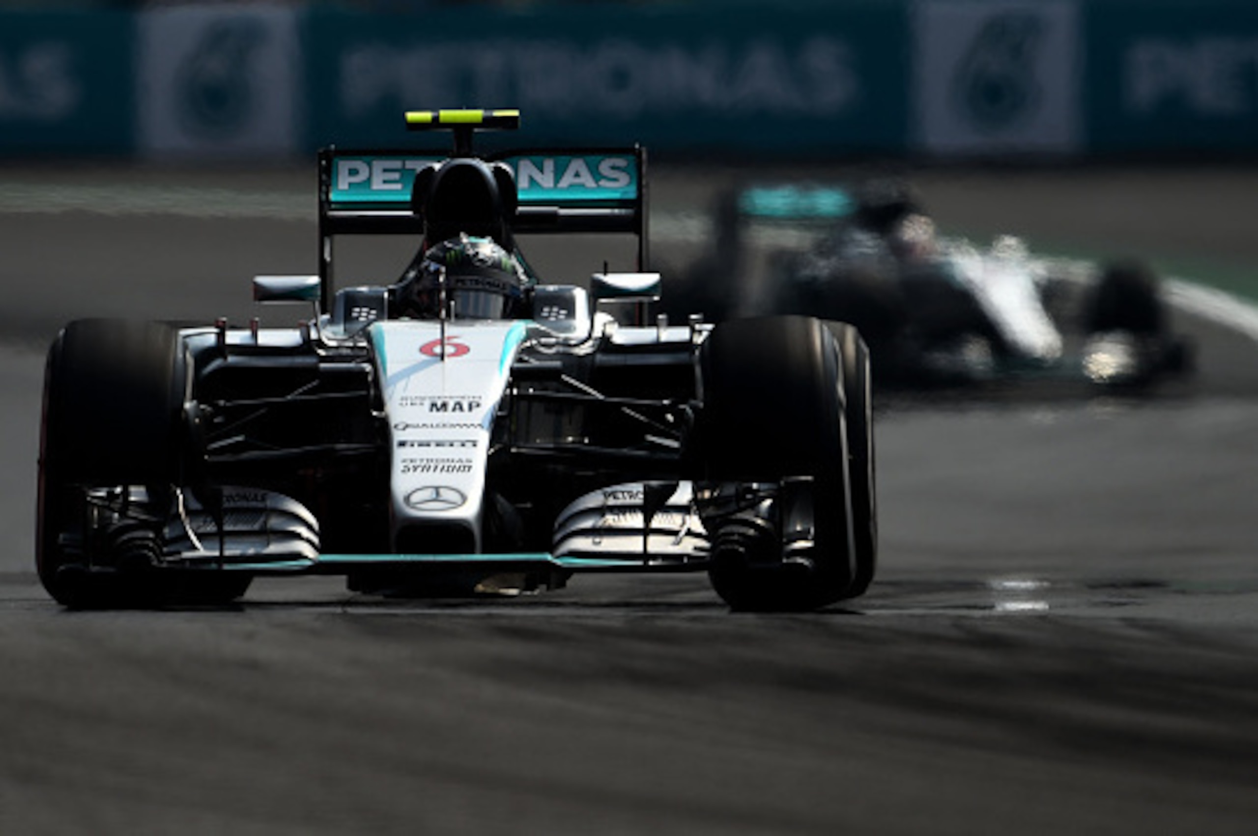 MEXICO CITY, MEXICO - NOVEMBER 01:  Nico Rosberg of Germany and Mercedes GP drives ahead of Lewis Hamilton of Great Britain and Mercedes GP during the Formula One Grand Prix of Mexico at Autodromo Hermanos Rodriguez  on November 1, 2015 in Mexico City, Me