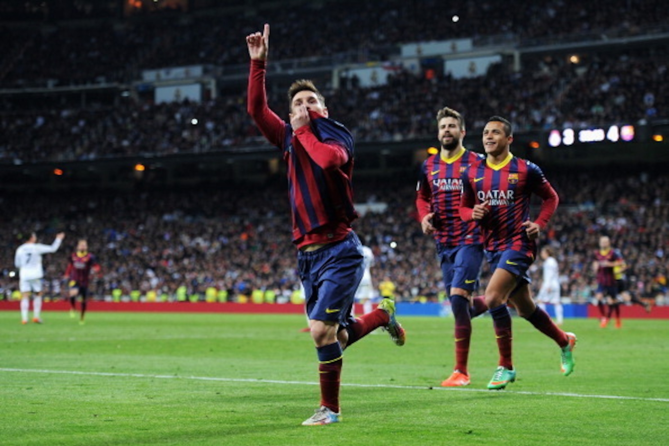 MADRID, SPAIN - MARCH 23:  Lionel Messi of Barcelona celebrates scoring his team's fourth goal during the La Liga match between Real Madrid CF and FC Barcelona at the Bernabeu on March 23, 2014 in Madrid, Spain.  (Photo by Denis Doyle/Getty Images)