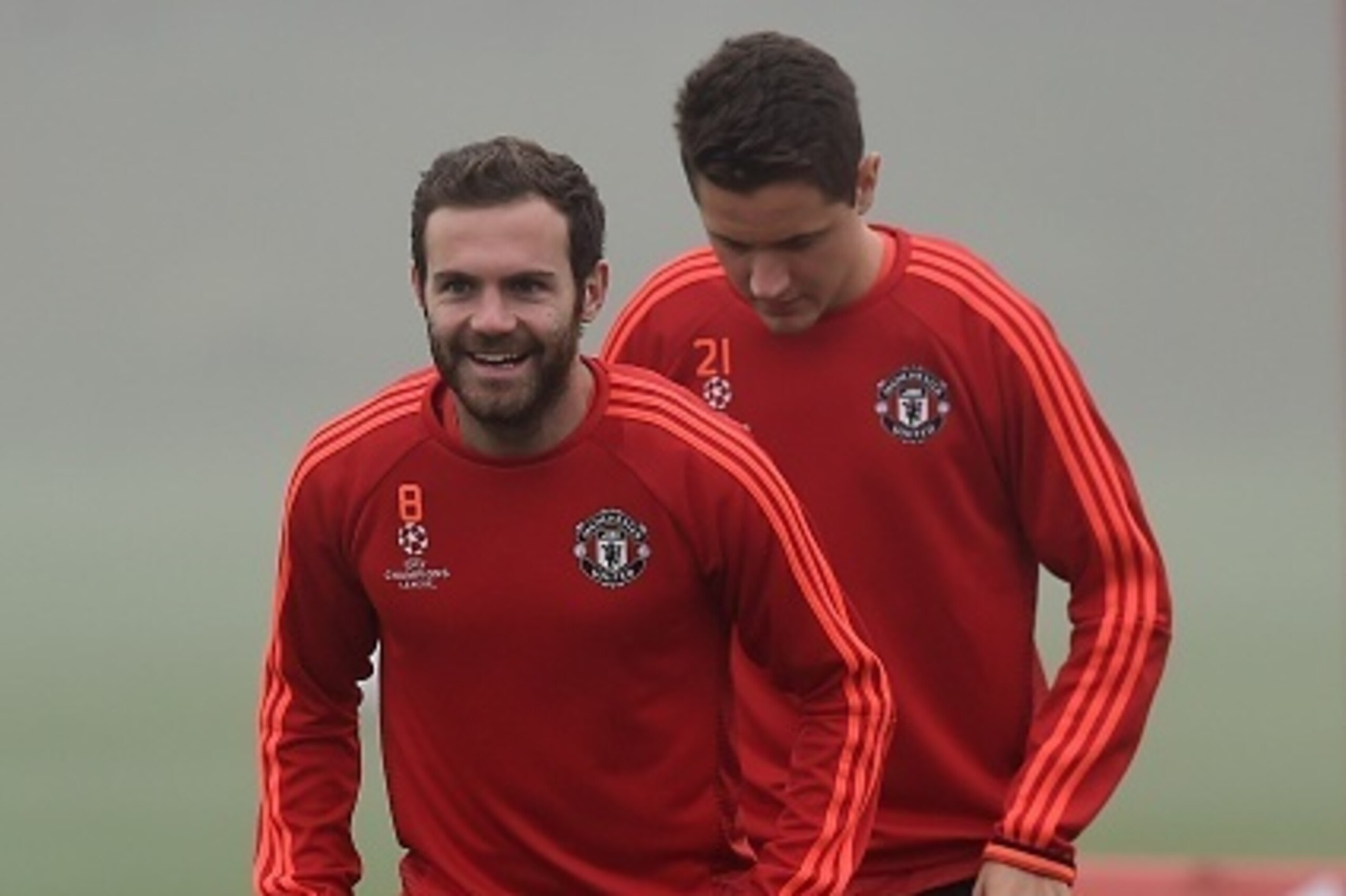 Manchester United's Spanish midfielder Juan Mata (front) and Manchester United's Spanish midfielder Ander Herrera (back) take part in a training session in Manchester, north west England, on November 2, 2015 ahead of their UEFA Champions League group B fo