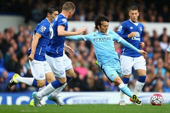 LIVERPOOL, ENGLAND - AUGUST 23:  David Silva of Manchester City shoots during the Barclays Premier League match between Everton and Manchester City at Goodison Park on August 23, 2015 in Liverpool, England.  (Photo by Clive Brunskill/Getty Images)