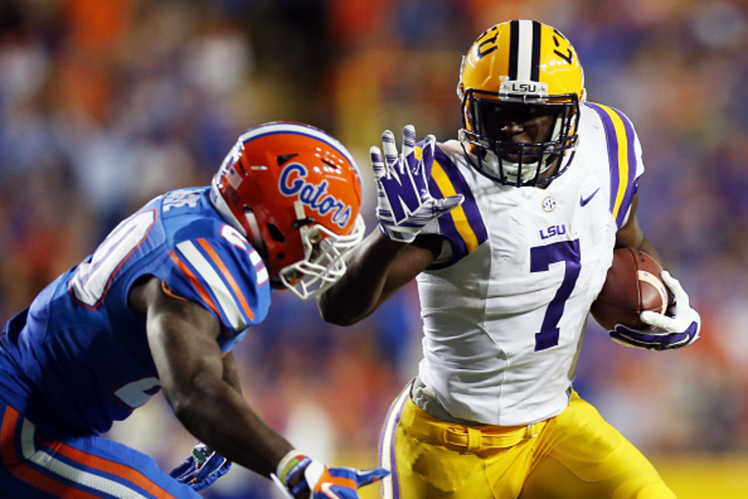 BATON ROUGE, LA - OCTOBER 17:  Leonard Fournette #7 of the LSU Tigers runs for a first down past Marcus Maye #20 of the Florida Gators at Tiger Stadium on October 17, 2015 in Baton Rouge, Louisiana.  (Photo by Chris Graythen/Getty Images)
