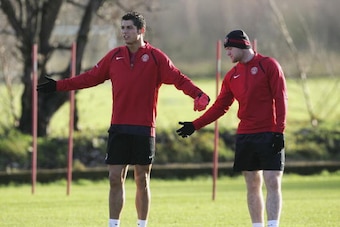MANCHESTER, UNITED KINGDOM - DECEMBER 05:  Cristiano Ronaldo and Wayne Rooney of Manchester United gesture during the Manchester United training session at the Carrington Training Complex on December 5, 2006 at Carrington in Manchester, England.  (Photo b