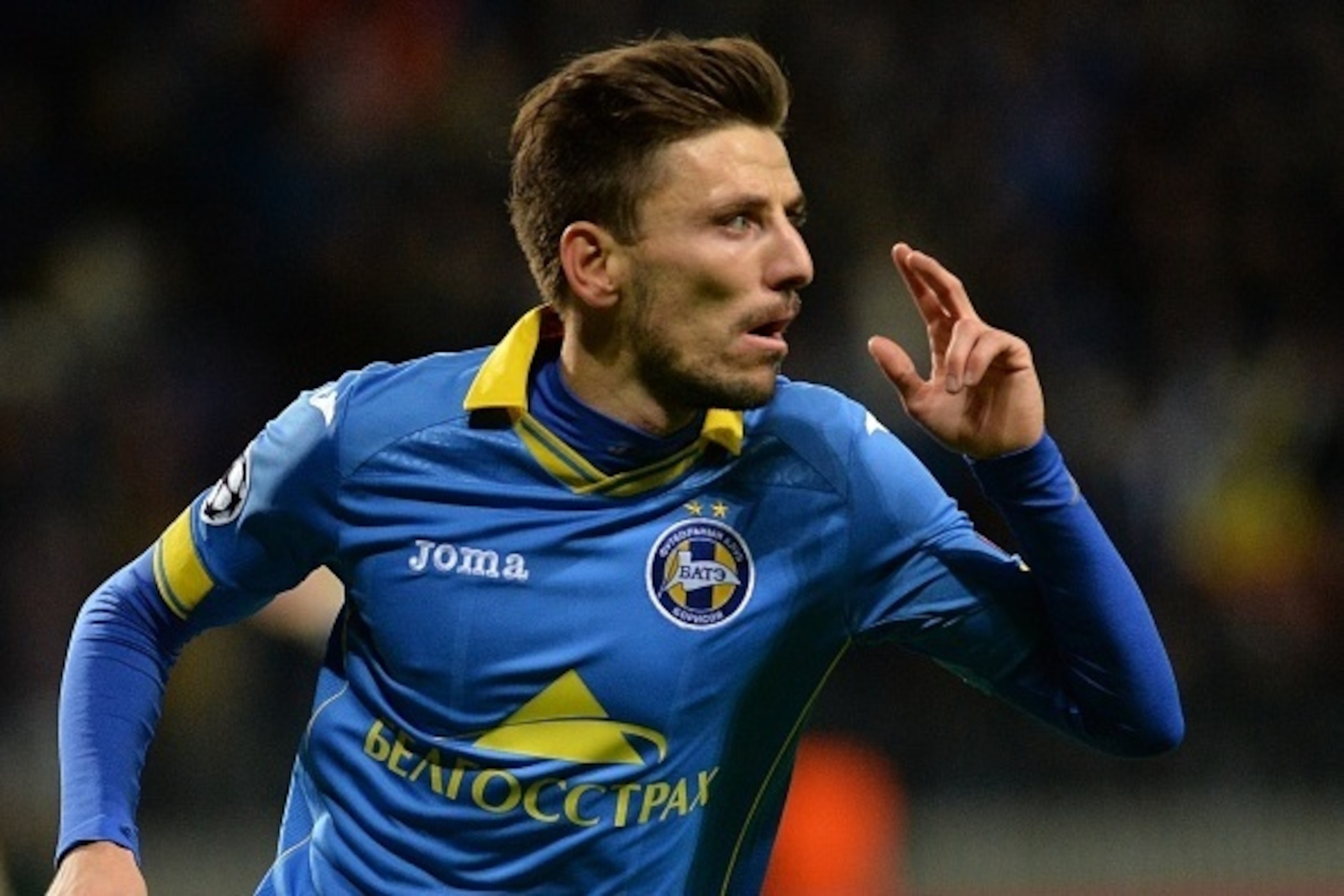 BATE Borisov's Serbian defender Filip Mladenovic celebrates a goal during the UEFA Champions League group E football match between FC BATE Borisov and AS Roma at the Borisov-Arena in Borisov outside Minsk on September 29, 2015. AFP PHOTO / MAXIM MALINOVSK