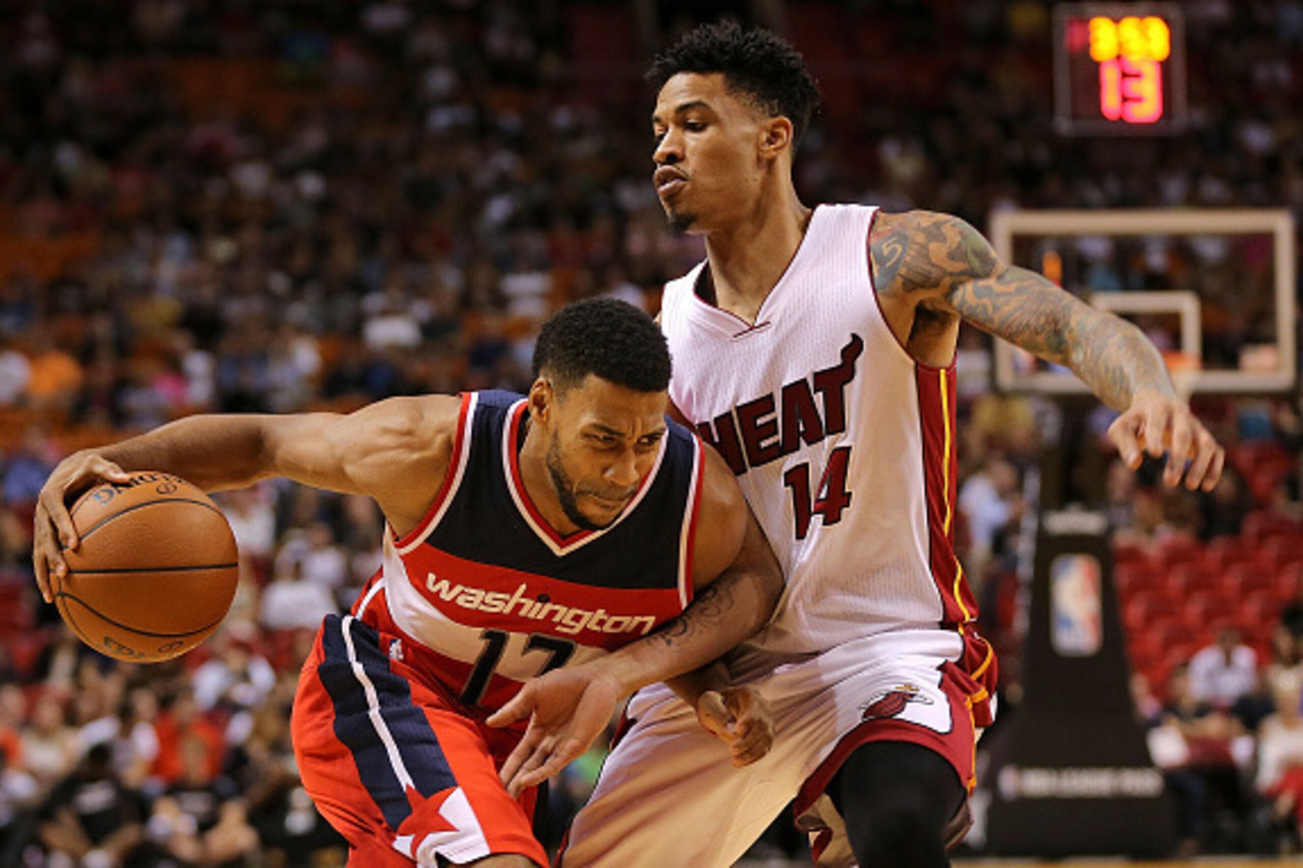 MIAMI, FL - OCTOBER 21: Garrett Temple #17 of the Washington Wizards drives on Gerald Green #14 of the Miami Heat during a preseason game at American Airlines Arena on October 21, 2015 in Miami, Florida. NOTE TO USER: User expressly acknowledges and agre MIAMI, FL - OCTOBER 21: Garrett Temple #17 of the Washington Wizards drives on Gerald Green #14 of the Miami Heat during a preseason game at American Airlines Arena on October 21, 2015 in Miami, Florida. NOTE TO USER: User expressly acknowledges and agre