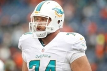 Nov 23, 2014; Denver, CO, USA; Miami Dolphins tackle Jason Fox (74) before the game against the Denver Broncos at Sports Authority Field at Mile High. Mandatory Credit: Chris Humphreys-USA TODAY Sports