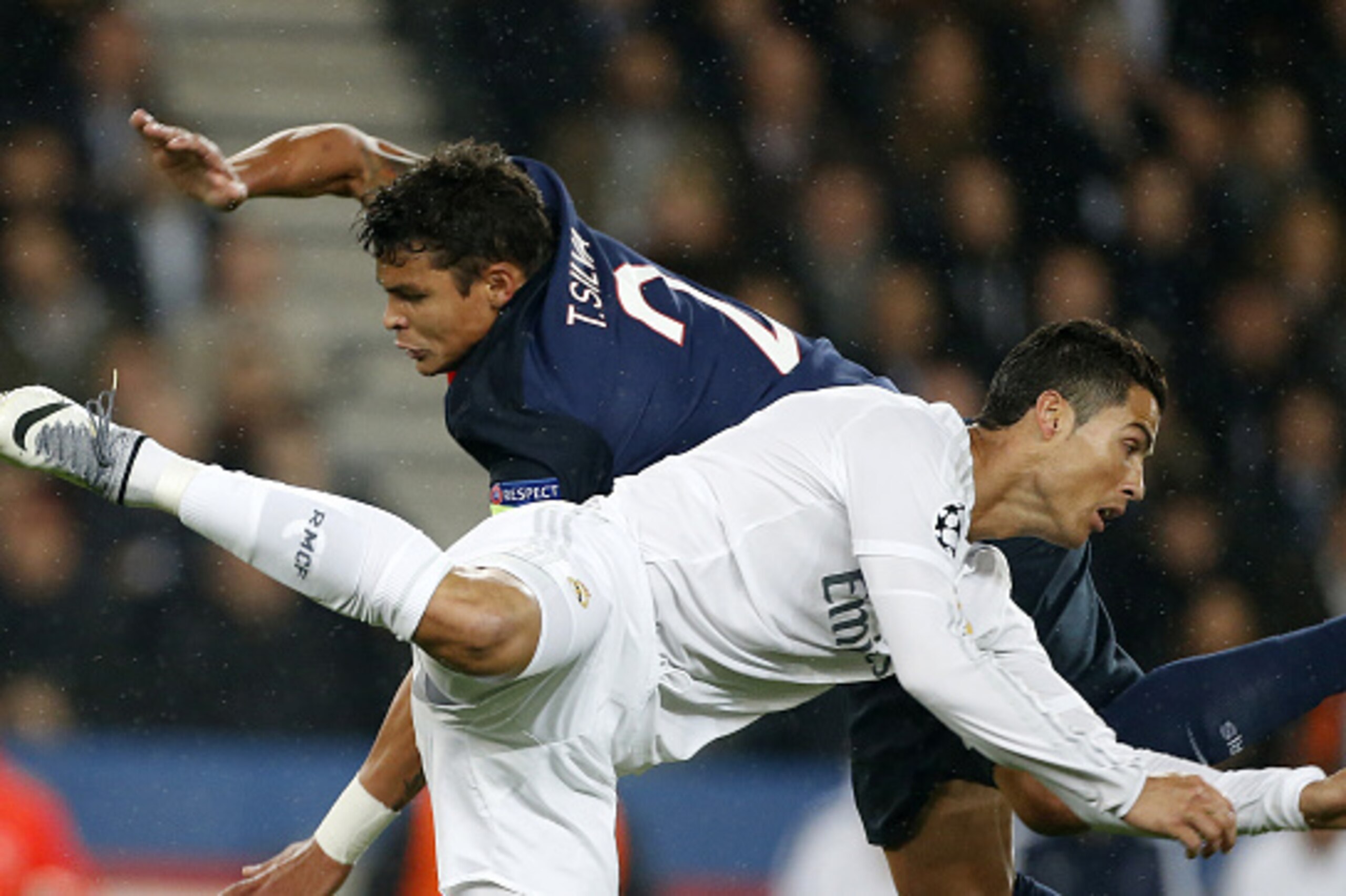 PARIS, FRANCE - OCTOBER 21: Thiago Silva of PSG and Cristiano Ronaldo of Real Madrid in action during the UEFA Champions League match between Paris Saint-Germain (PSG) and Real Madrid at Parc des Princes stadium on October 21, 2015 in Paris, France. (Phot PARIS, FRANCE - OCTOBER 21: Thiago Silva of PSG and Cristiano Ronaldo of Real Madrid in action during the UEFA Champions League match between Paris Saint-Germain (PSG) and Real Madrid at Parc des Princes stadium on October 21, 2015 in Paris, France. (Phot