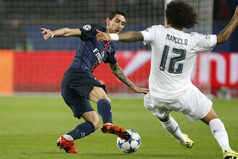 PARIS, FRANCE - OCTOBER 21: Angel Di Maria of PSG and Marcelo of Real Madrid in action during the UEFA Champions League match between Paris Saint-Germain (PSG) and Real Madrid at Parc des Princes stadium on October 21, 2015 in Paris, France. (Photo by Jea