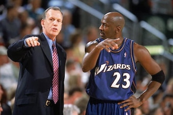 SEATTLE - MARCH 26:  Head coach Doug Collins and Michael Jordan #23 of the Washington Wizards discuss a play during the NBA game against the Seattle Sonics at Key Arena on March 26, 2003 in Seattle, Washington.  The Wizards won 80-74.  NOTE TO USER: User 