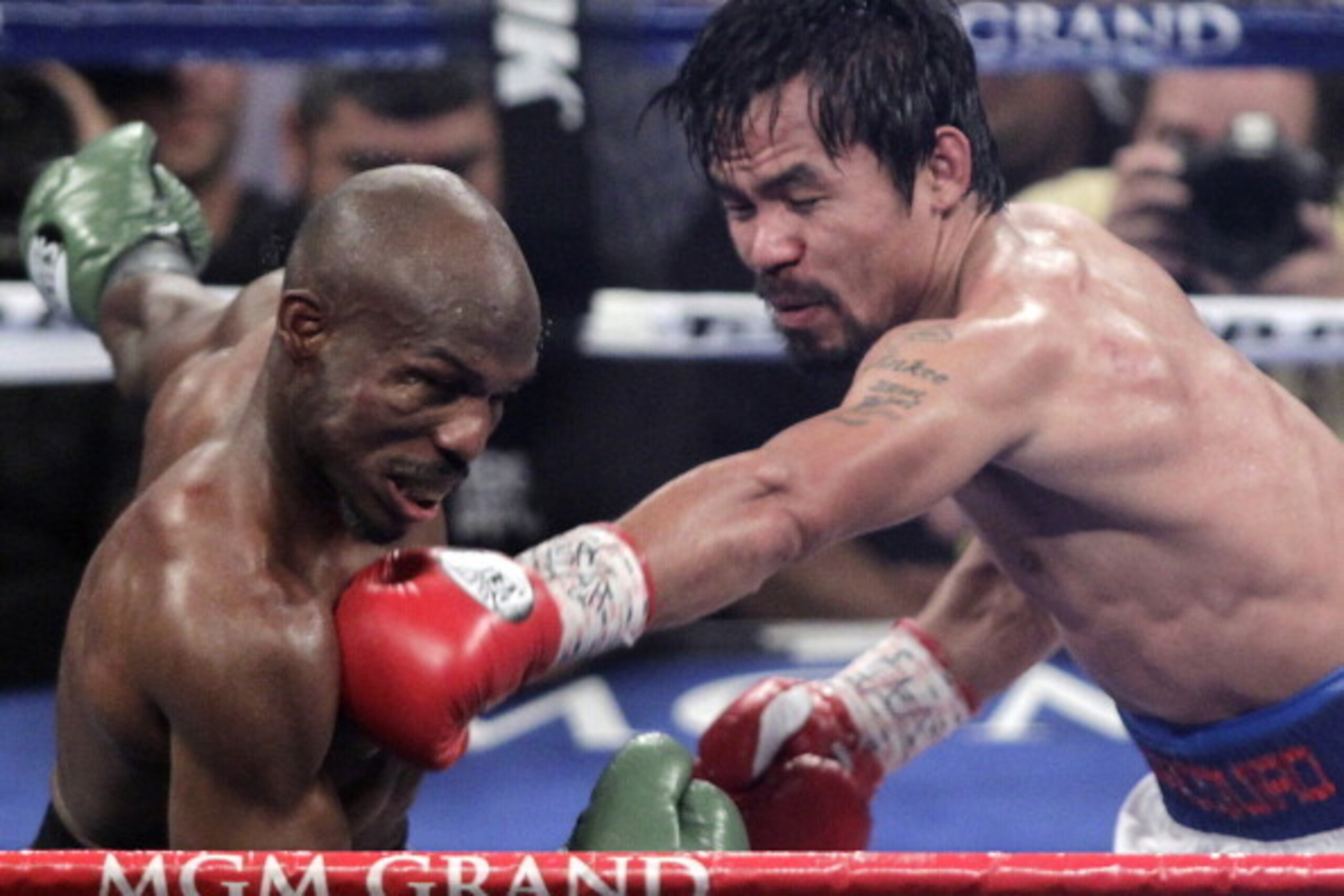 Manny Pacquiao (R) of the Philippines connects against Timothy Bradley (L) of the US during their WBO welterweight title fight on April 12, 2014 at the MGM Grand Garden Arena in Las Vegas, Nevada.     Pacquiao  won a 12-round unanimous decision over Bradl
