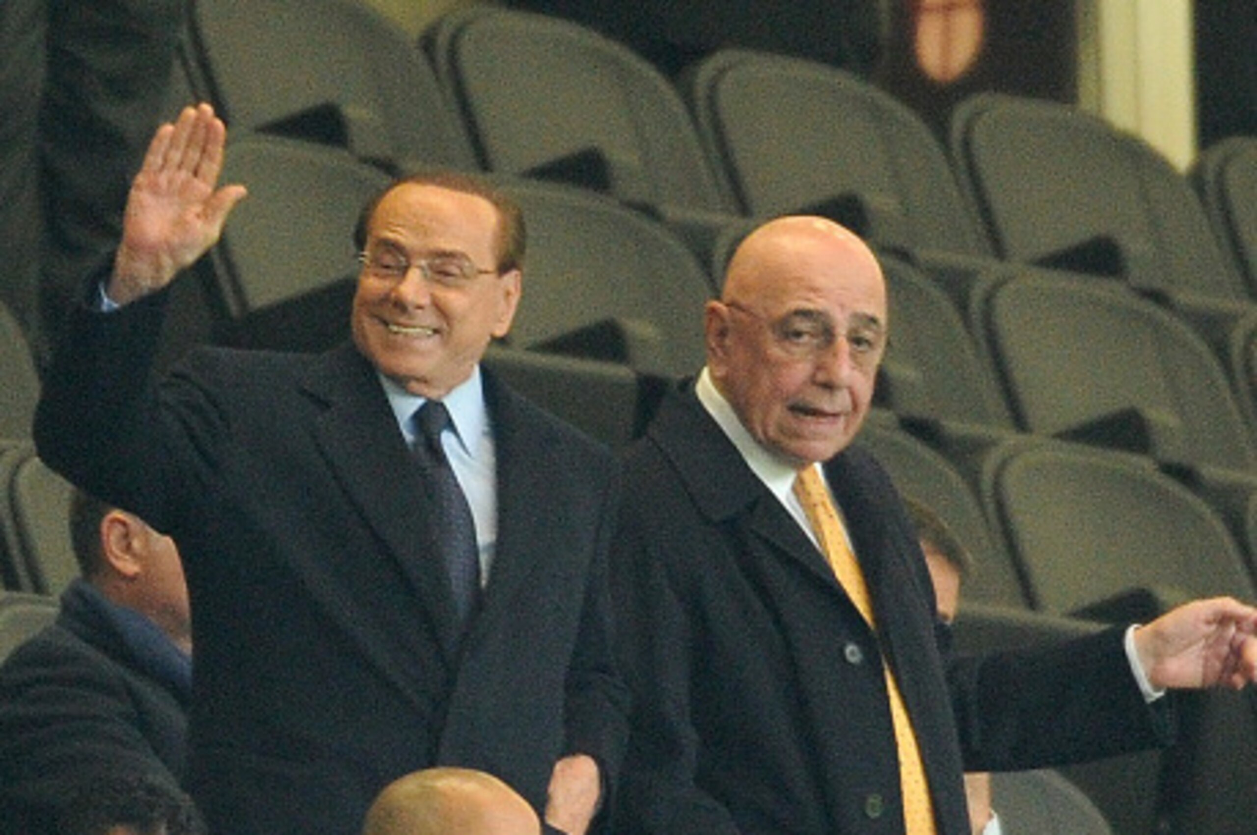 MILAN, ITALY - OCTOBER 21:  (L-R) President of AC Milan Silvio Berlusconi and Adriano Galliani atend the Berlusconi Trophy match between AC Milan and FC Internazionale at Stadio Giuseppe Meazza on October 21, 2015 in Milan, Italy.  (Photo by Pier Marco Ta