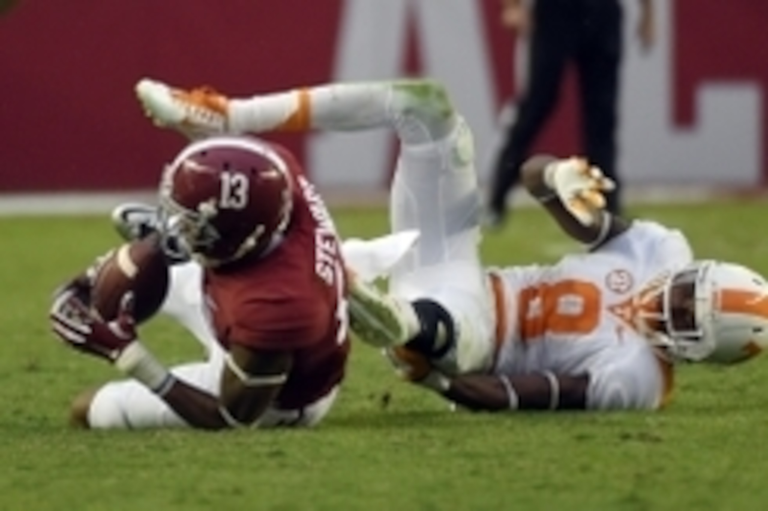 Oct 24, 2015; Tuscaloosa, AL, USA; Alabama Crimson Tide wide receiver ArDarius Stewart (13) pulls down a pass over Tennessee Volunteers defensive back Justin Martin (8) during the fourth quarter at Bryant-Denny Stadium. Mandatory Credit: John David Mercer