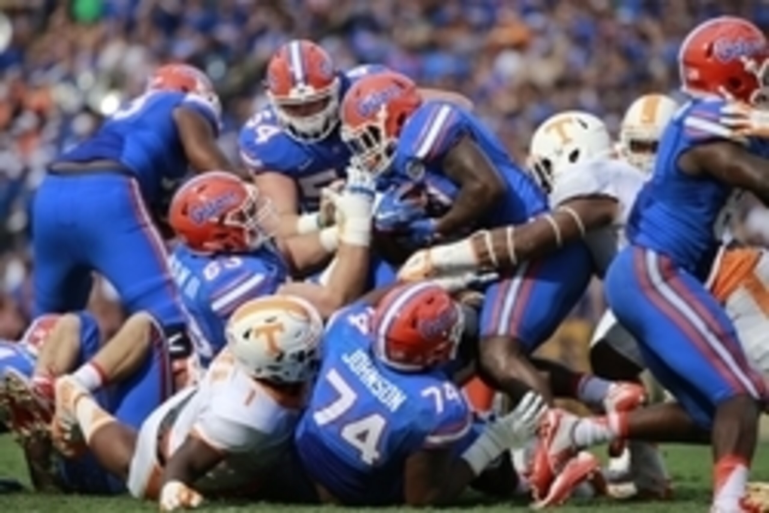 Sep 26, 2015; Gainesville, FL, USA;  Florida Gators running back Kelvin Taylor (21) runs with the ball as Tennessee Volunteers defensive lineman Kahlil McKenzie (1) and defensive lineman LaTroy Lewis (4) tackle during the first half at Ben Hill Griffin St