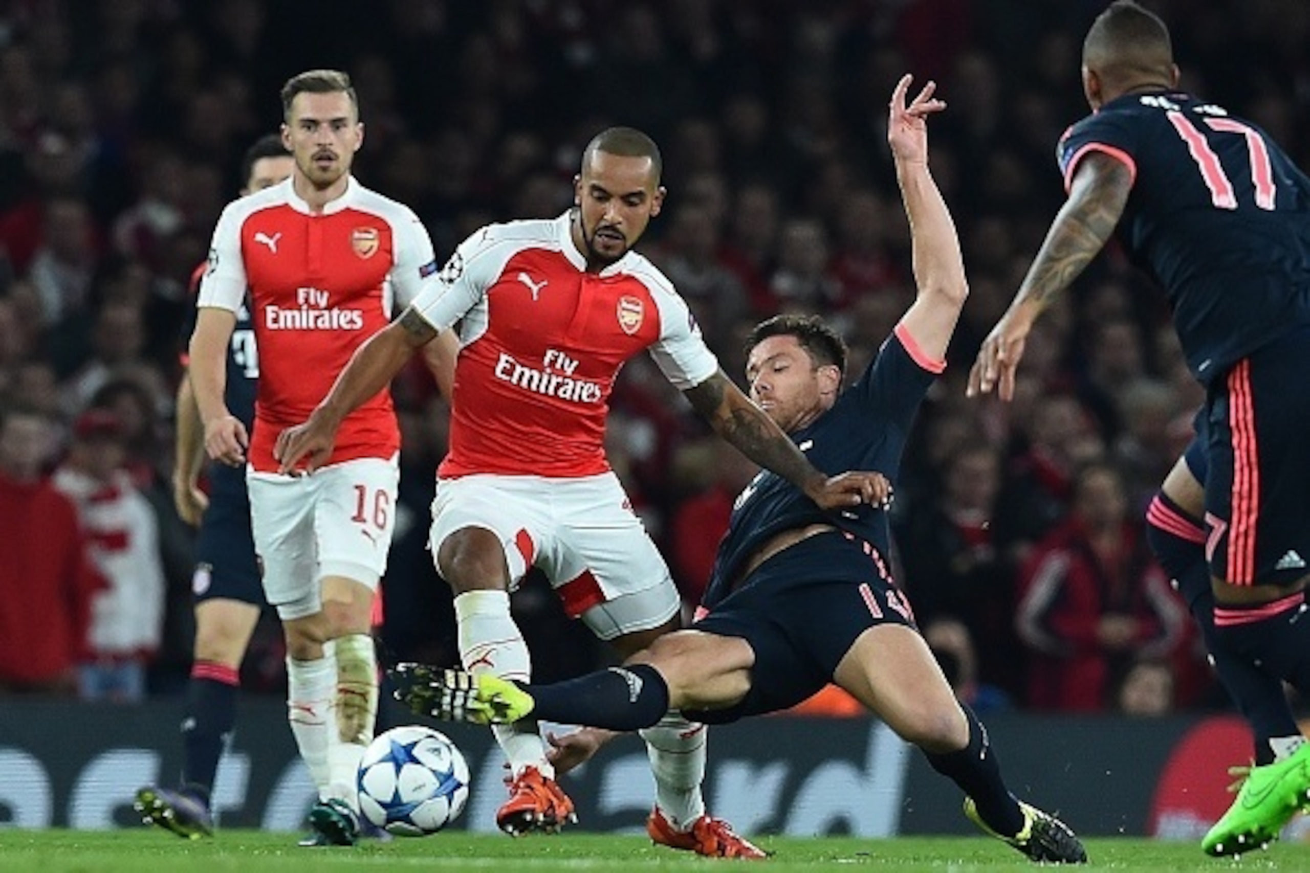 Bayern Munich's Spanish midfielder Xabi Alonso (2R) vies against Arsenal's English midfielder Theo Walcott (2L) during the UEFA Champions League football match between Arsenal and Bayern Munich at the Emirates Stadium in London, on October 20, 2015. AF Bayern Munich's Spanish midfielder Xabi Alonso (2R) vies against Arsenal's English midfielder Theo Walcott (2L) during the UEFA Champions League football match between Arsenal and Bayern Munich at the Emirates Stadium in London, on October 20, 2015. AF