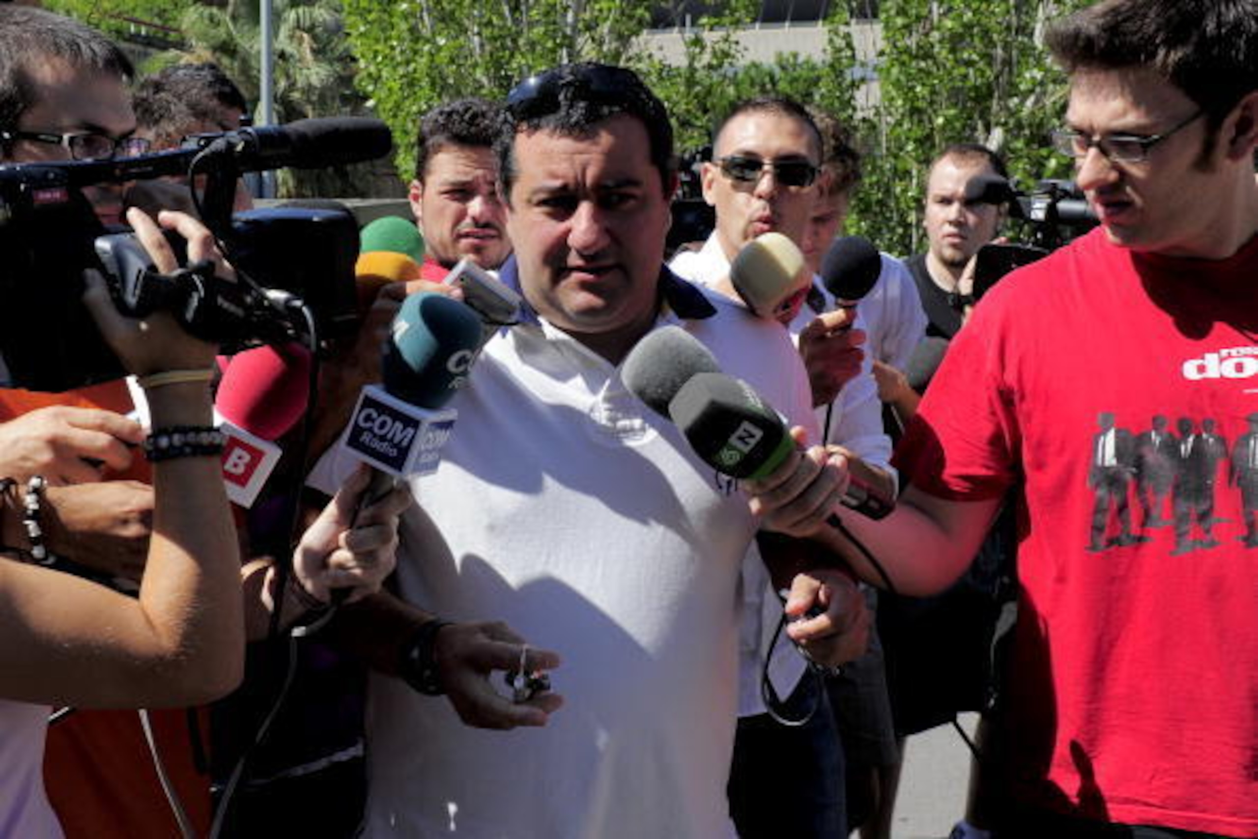 Representative for Barcelona's Swedish forward Zlatan Ibrahimovic, Mino Raiola (C), arrives  at the offices of Barcelona FC allegedly to sign Ibrahimovic, in Barcelona on August 26, 2010.  Swedish forward Zlatan Ibrahimovic revealed that his Barcelona bos