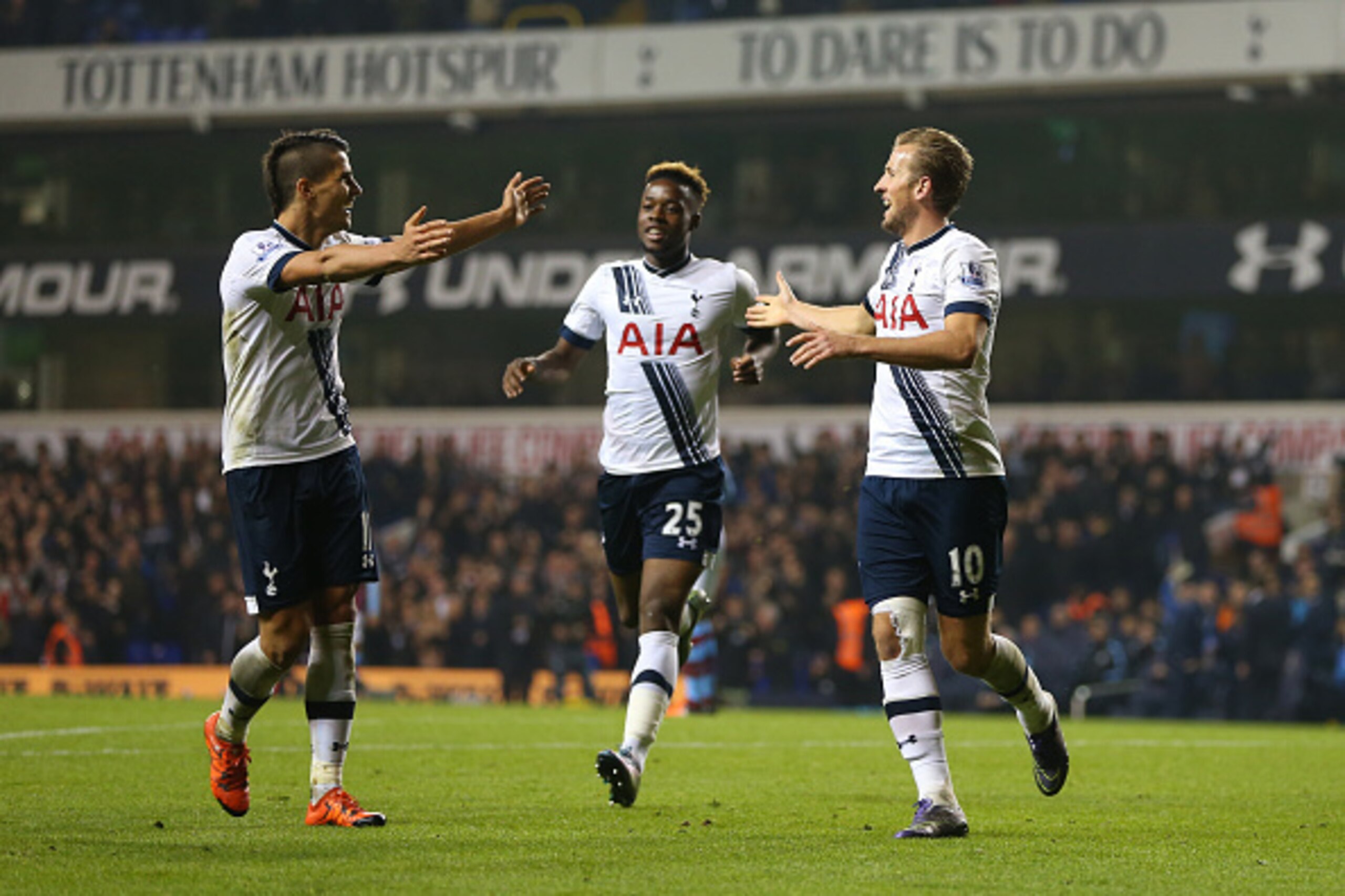 LONDON, ENGLAND - NOVEMBER 02:  Harry Kane of Tottenham Hotspur celebrates after he scores to make it 3-1 with Erik Lamela of Tottenham Hotspur during the Barclays Premier League match between Tottenham Hotspur and Aston Villa at White Hart Lane on Novemb