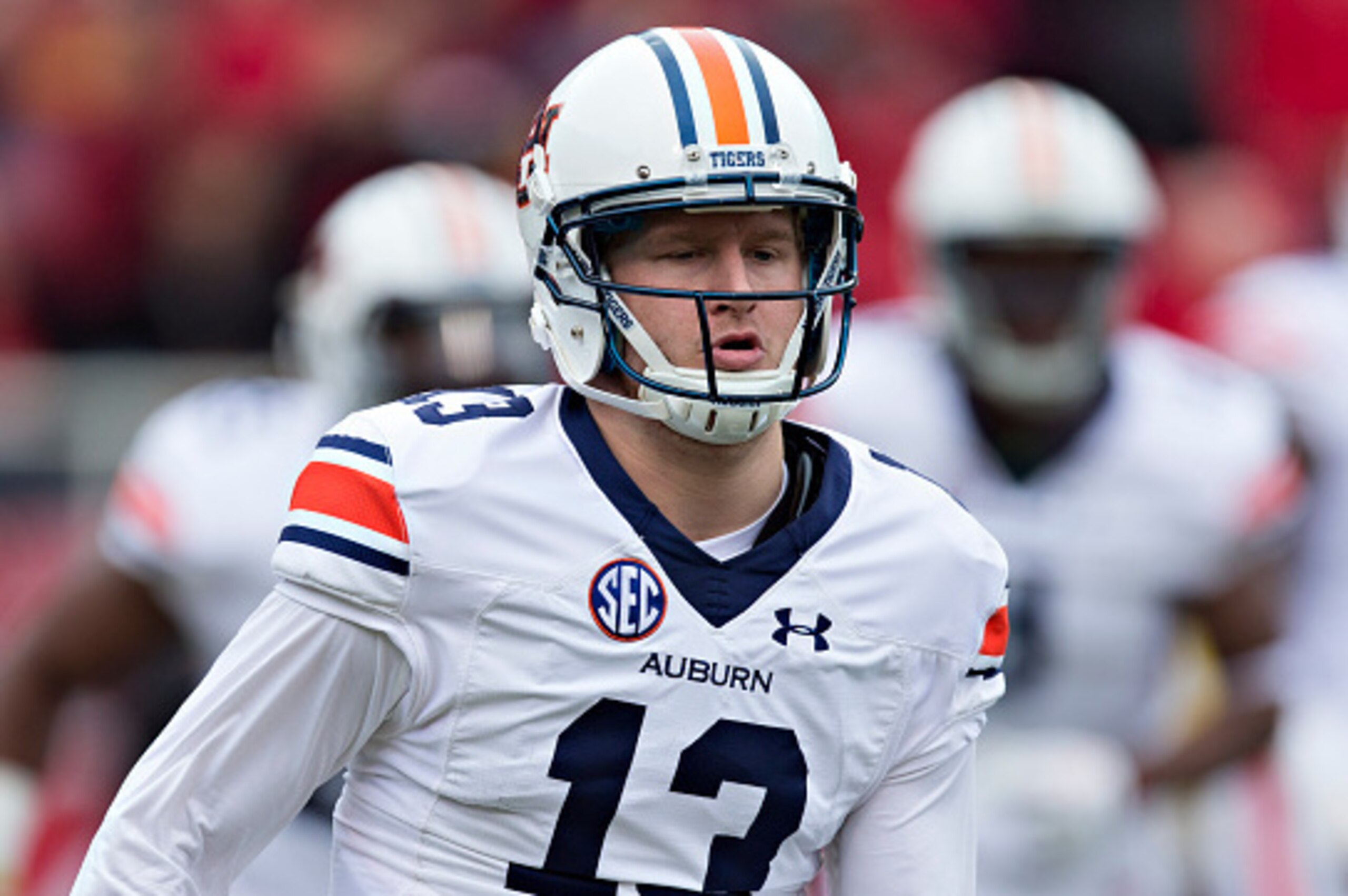 FAYETTEVILLE, AR - OCTOBER 24:  Sean White #13 of the Auburn Tigers jogs off the field during a game against the Arkansas Razorbacks at Razorback Stadium Stadium on October 24, 2015 in Fayetteville, Arkansas.  The Razorbacks defeated the Tigers in 4 OT's 