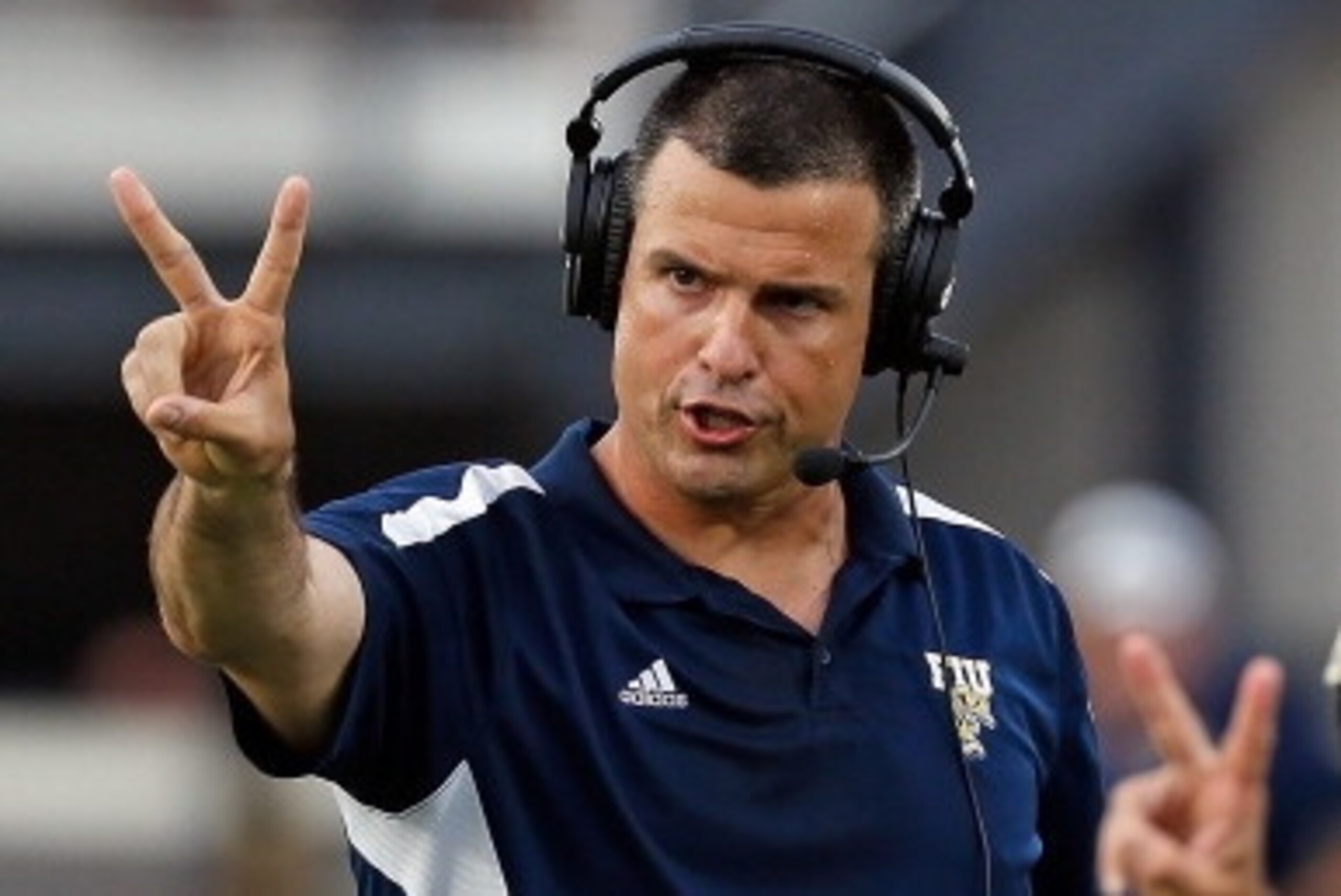 ORLANDO, FL - SEPTEMBER 15:  Head coach Mario Cristobal of the Florida International Panthers calls for a two point conversino against the Central Florida Knights during the game at Bright House Networks Stadium on September 15, 2012 in Orlando, Florida. 