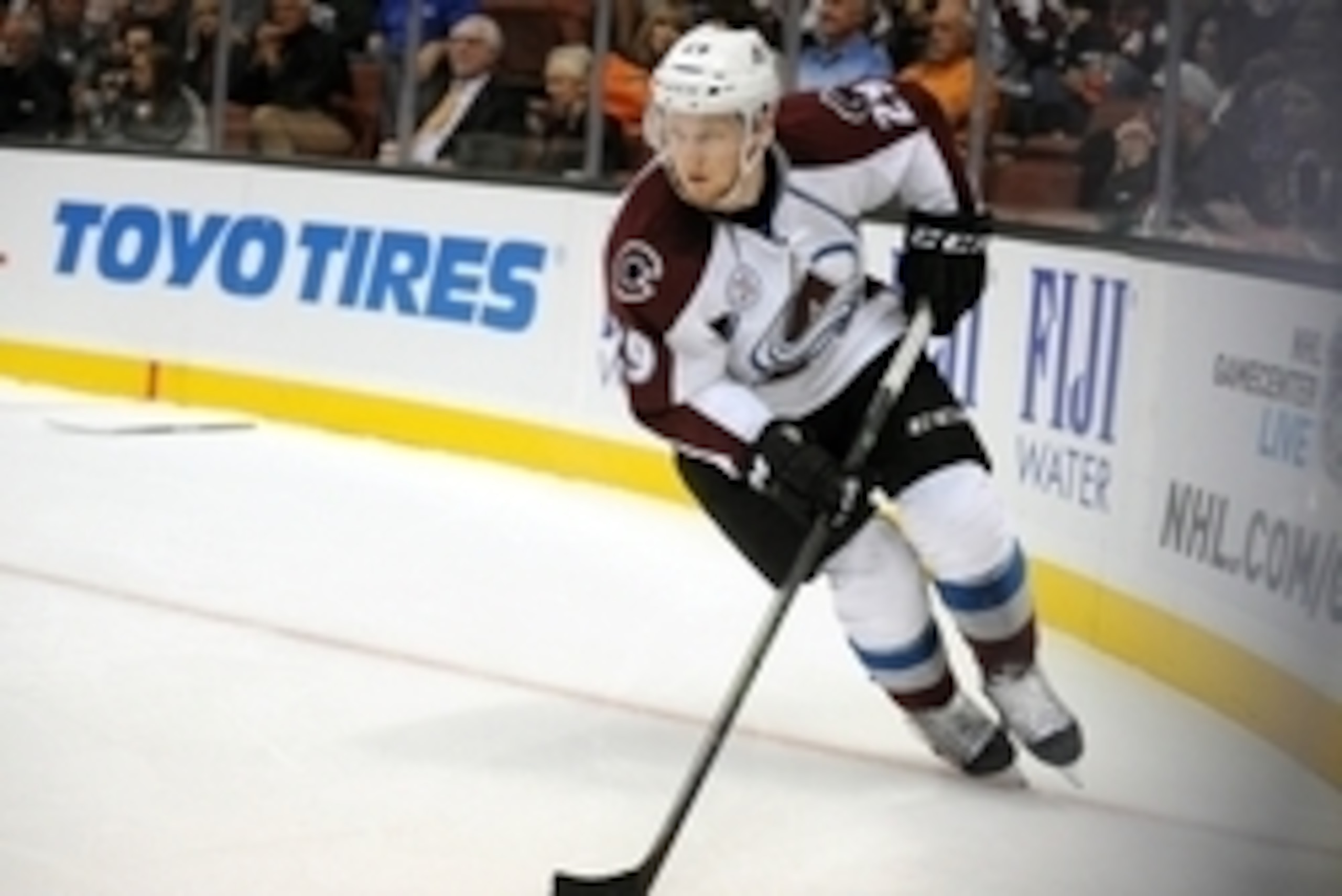 October 16, 2015; Anaheim, CA, USA; Colorado Avalanche center Nathan MacKinnon (29) controls the puck against the Anaheim Ducks during the first period at Honda Center. Mandatory Credit: Gary A. Vasquez-USA TODAY Sports