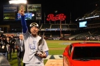 Nov 1, 2015; New York City, NY, USA; Kansas City Royals catcher Salvador Perez is presented with the series MVP award and a car after defeating the New York Mets in game five of the World Series at Citi Field. The Royals win the World Series four games to