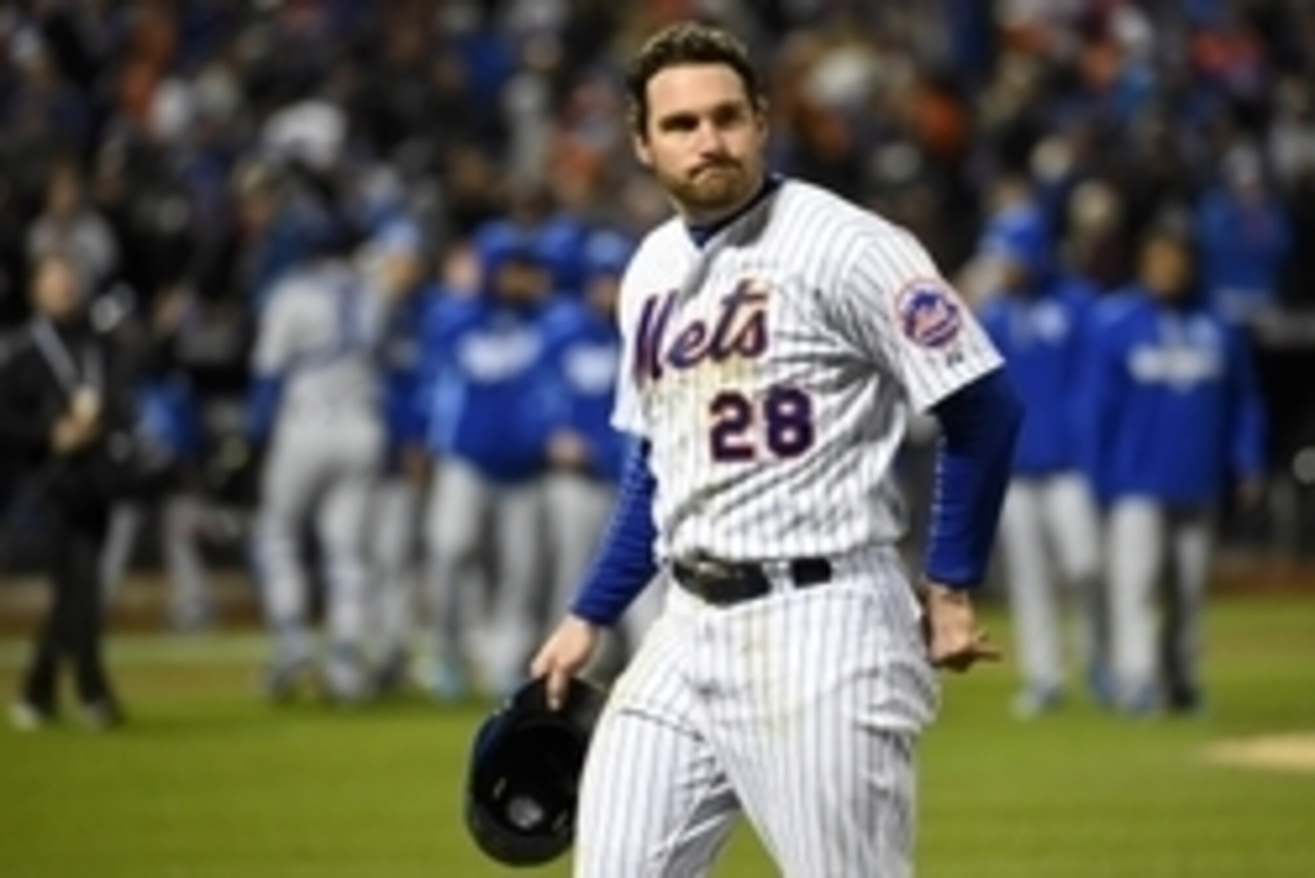 Oct 31, 2015; New York City, NY, USA; New York Mets second baseman Daniel Murphy (28) walks off the field after the Kansas City Royals win 5-3 in game four of the World Series at Citi Field. Mandatory Credit: Robert Deutsch-USA TODAY Sports