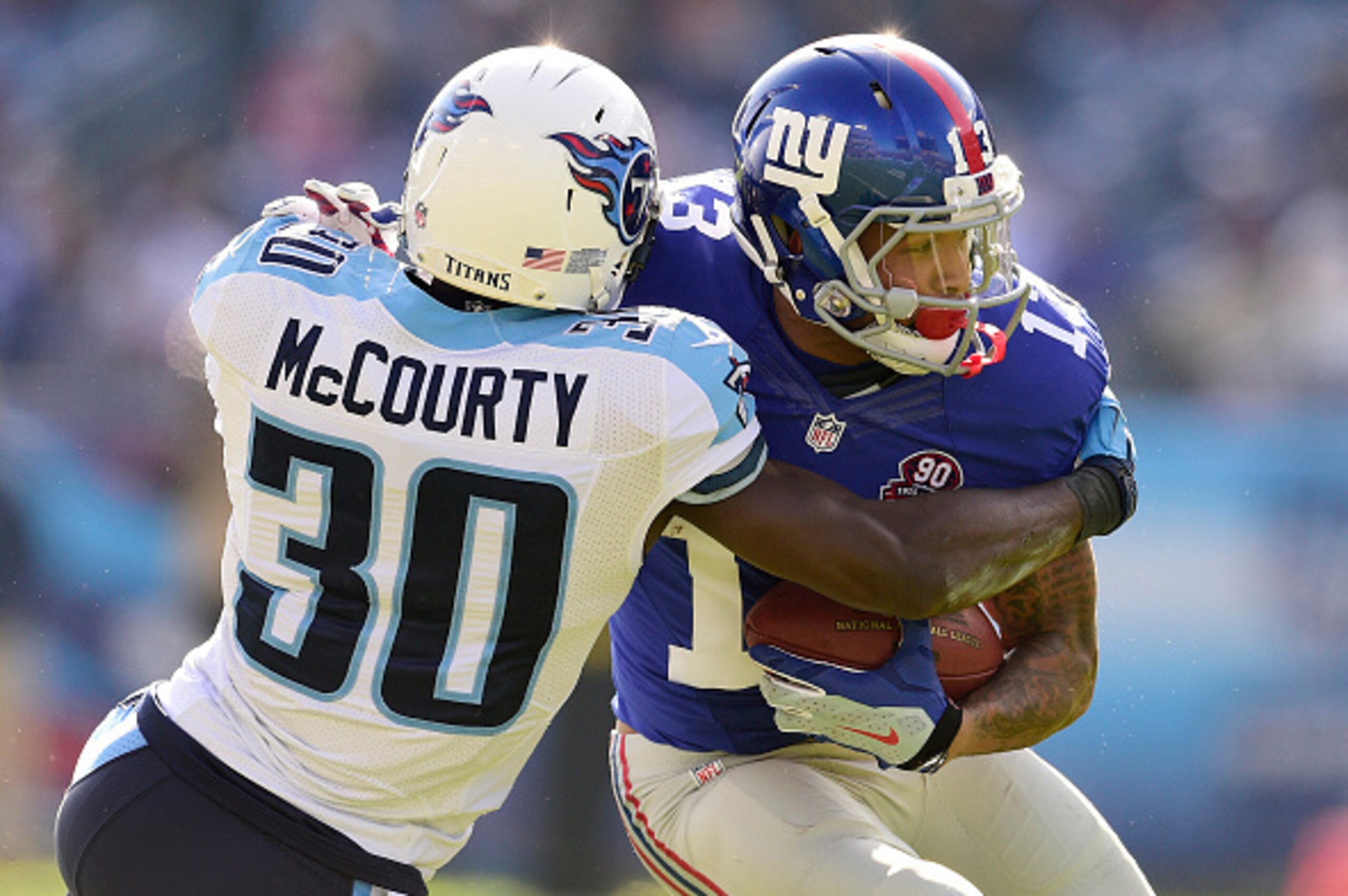 NASHVILLE, TN - DECEMBER 07: Wide receiver Odell Beckham Jr. #13 of the New York Giants catches a pass as Jason McCourty #30 of the Tennessee Titans defends during.a NFL game at LP Field on December 7, 2014 in Nashville, Tennessee. (Photo by Ronald C. M NASHVILLE, TN - DECEMBER 07: Wide receiver Odell Beckham Jr. #13 of the New York Giants catches a pass as Jason McCourty #30 of the Tennessee Titans defends during.a NFL game at LP Field on December 7, 2014 in Nashville, Tennessee. (Photo by Ronald C. M
