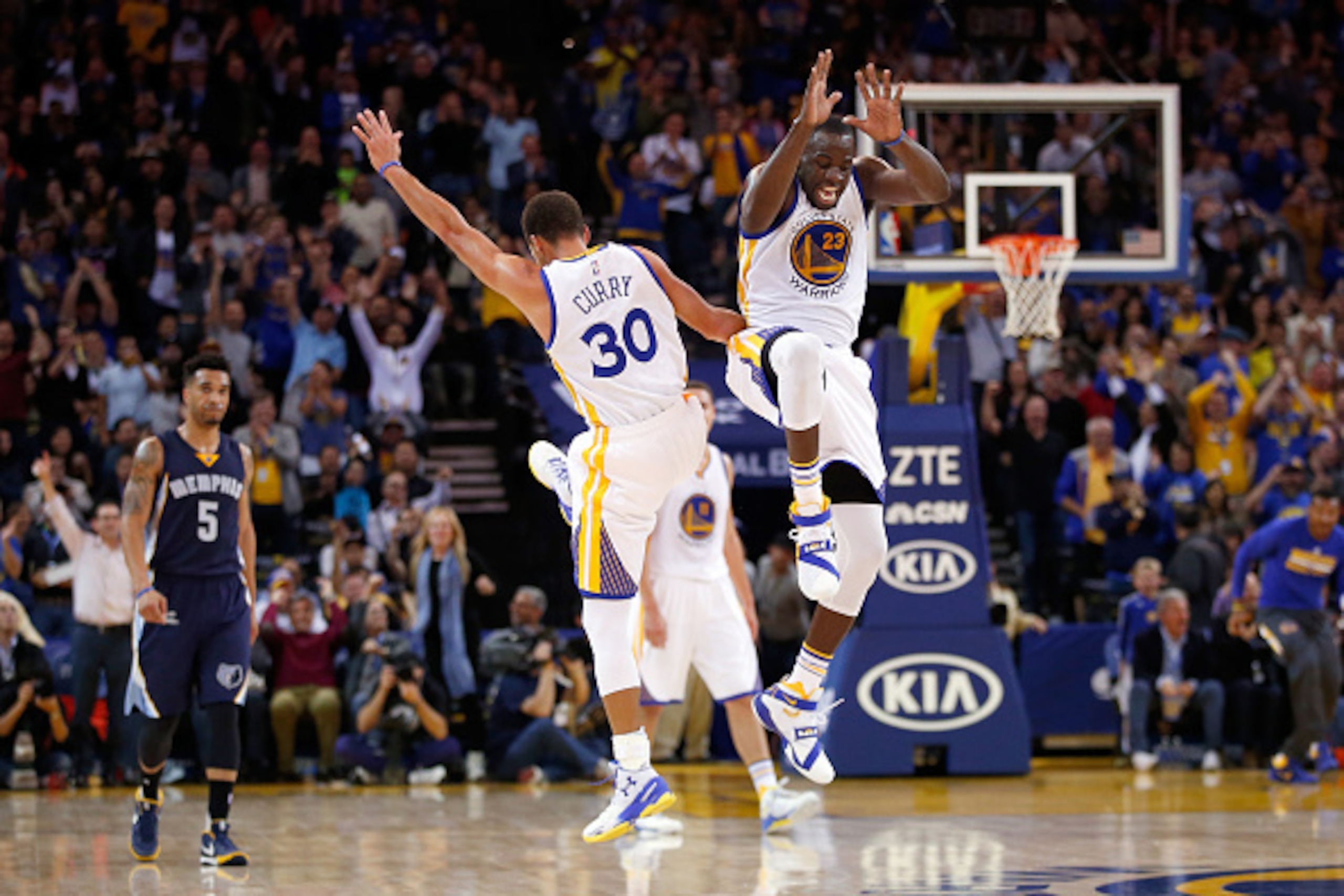 OAKLAND, CA - NOVEMBER 02: Stephen Curry #30 and Draymond Green #23 of the Golden State Warriors celebrate after Curry made a basket against the Memphis Grizzlies at ORACLE Arena on November 2, 2015 in Oakland, California. NOTE TO USER: User expressly ac OAKLAND, CA - NOVEMBER 02: Stephen Curry #30 and Draymond Green #23 of the Golden State Warriors celebrate after Curry made a basket against the Memphis Grizzlies at ORACLE Arena on November 2, 2015 in Oakland, California. NOTE TO USER: User expressly ac