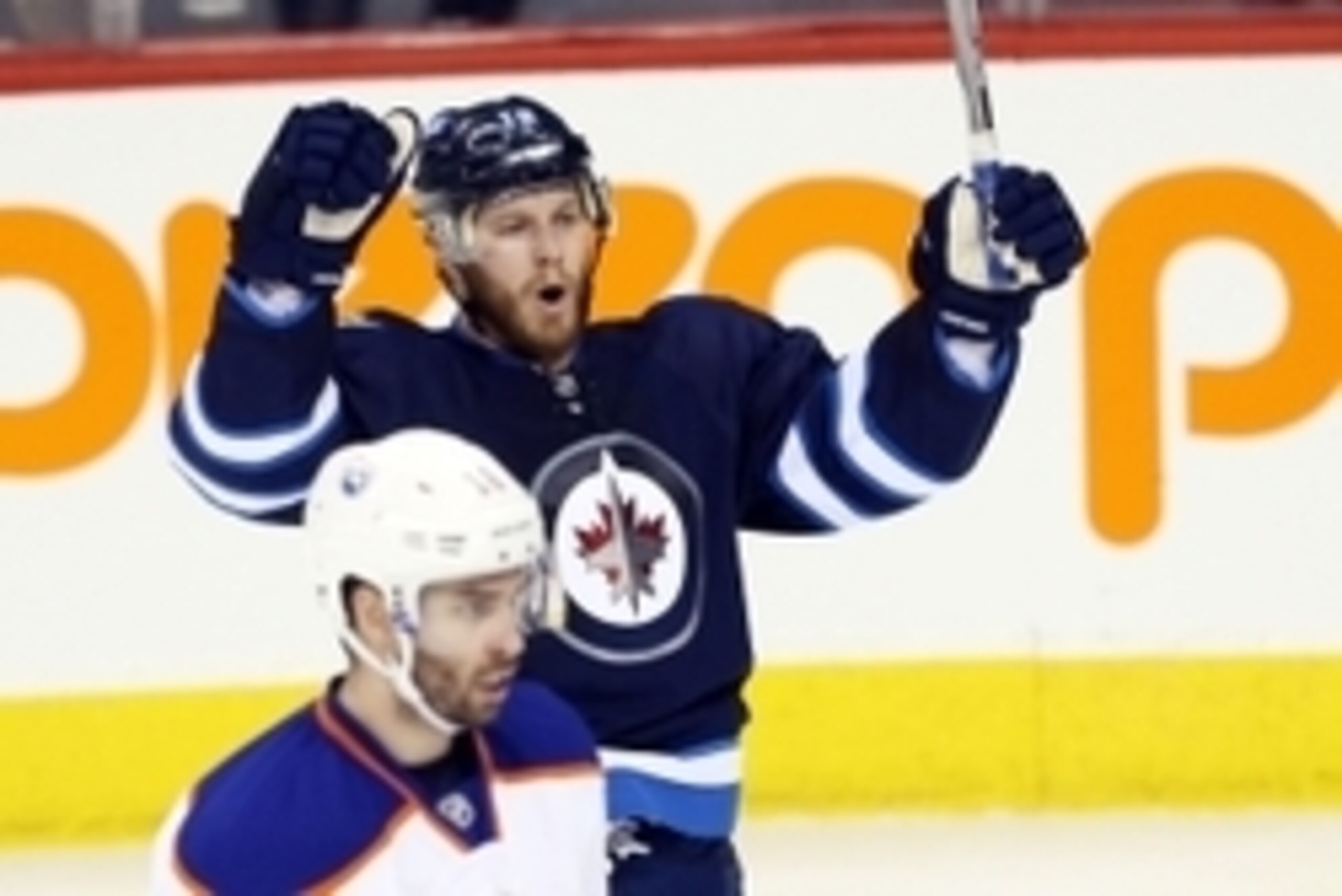 Feb 16, 2015; Winnipeg, Manitoba, CAN; Winnipeg Jets forward Bryan Little (18) celebrates his goal on Edmonton Oilers  goalie Viktor Fasth (35) during the second period at MTS Centre. Mandatory Credit: Bruce Fedyck-USA TODAY Sports