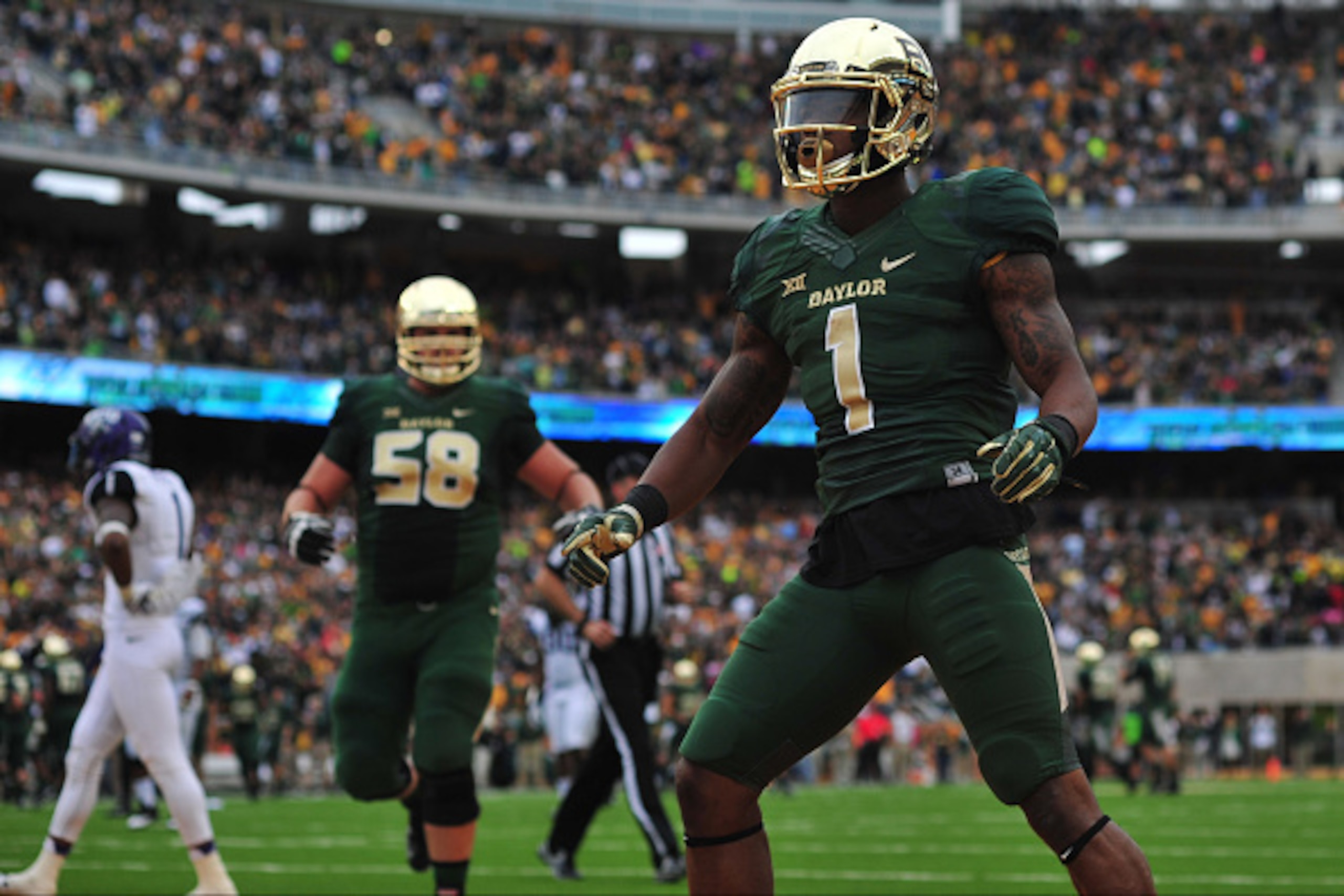 WACO, TX - OCTOBER 11:  Corey Coleman #1 of the Baylor Bears celebrates after a touchdown against the TCU Horned Frogs on October 11, 2014 at McLane Stadium in Waco, Texas.  (Photo by Cooper Neill/Getty Images)