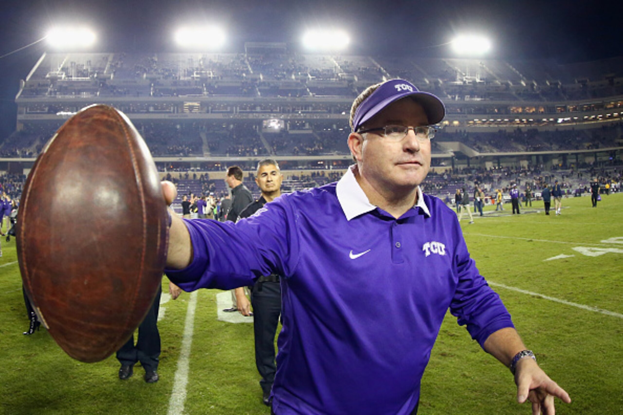 FORT WORTH, TX - OCTOBER 29:  Head coach Gary Patterson of the TCU Horned Frogs throws a game ball into the stands after the Horned Frogs beat the West Virginia Mountaineers 40-10 at Amon G. Carter Stadium on October 29, 2015 in Fort Worth, Texas.  (Photo