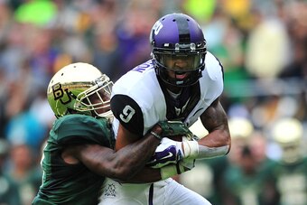 WACO, TX - OCTOBER 11:  Josh Doctson #9 of the TCU Horned Frogs is brought down by the Baylor Bears on October 11, 2014 at McLane Stadium in Waco, Texas.  (Photo by Cooper Neill/Getty Images)