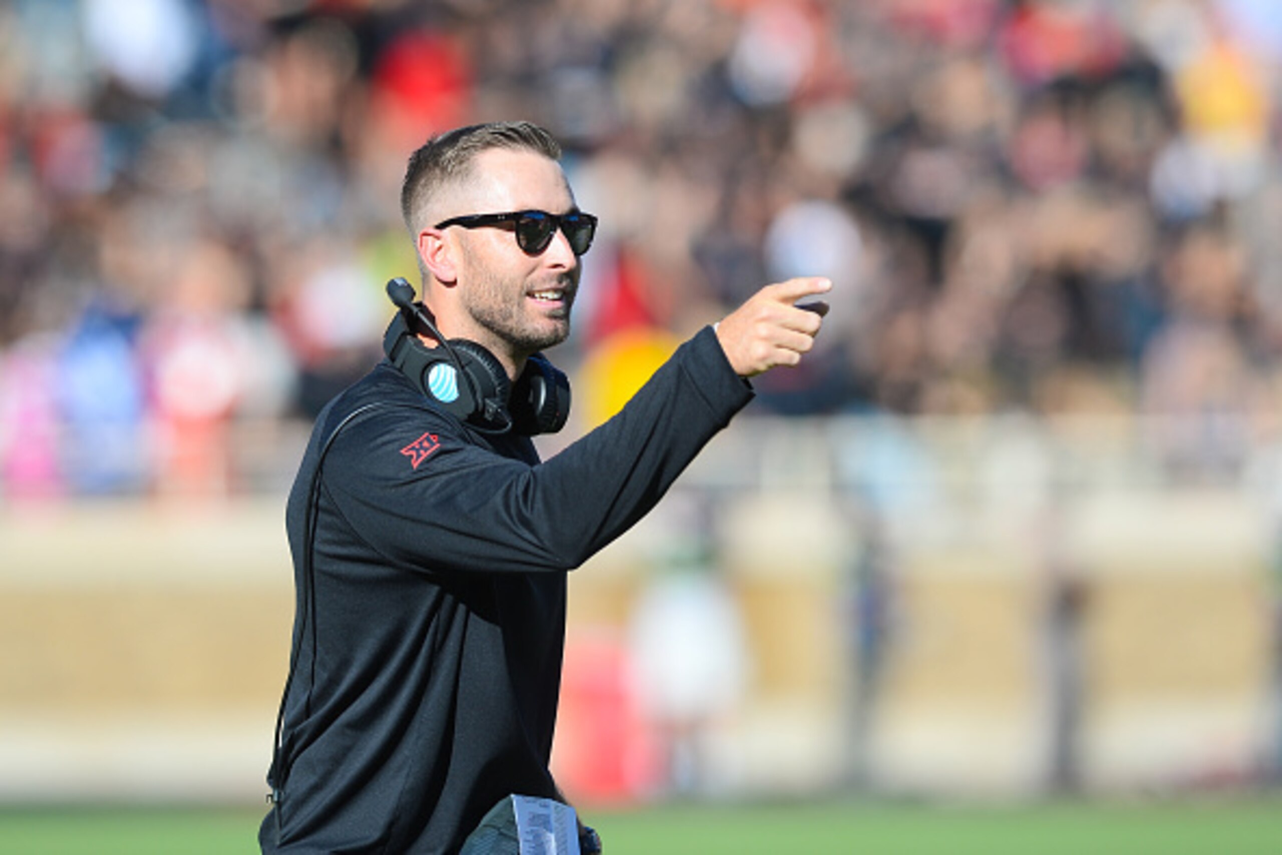 LUBBOCK, TX - OCTOBER 31: Head coach Kliff Kingsbury of the Texas Tech Red Raiders gives encouragement during the game against the Oklahoma State Cowboys on October 31, 2015 at Jones AT&T Stadium in Lubbock, Texas. Oklahoma State defeated Texas Tech 70-53