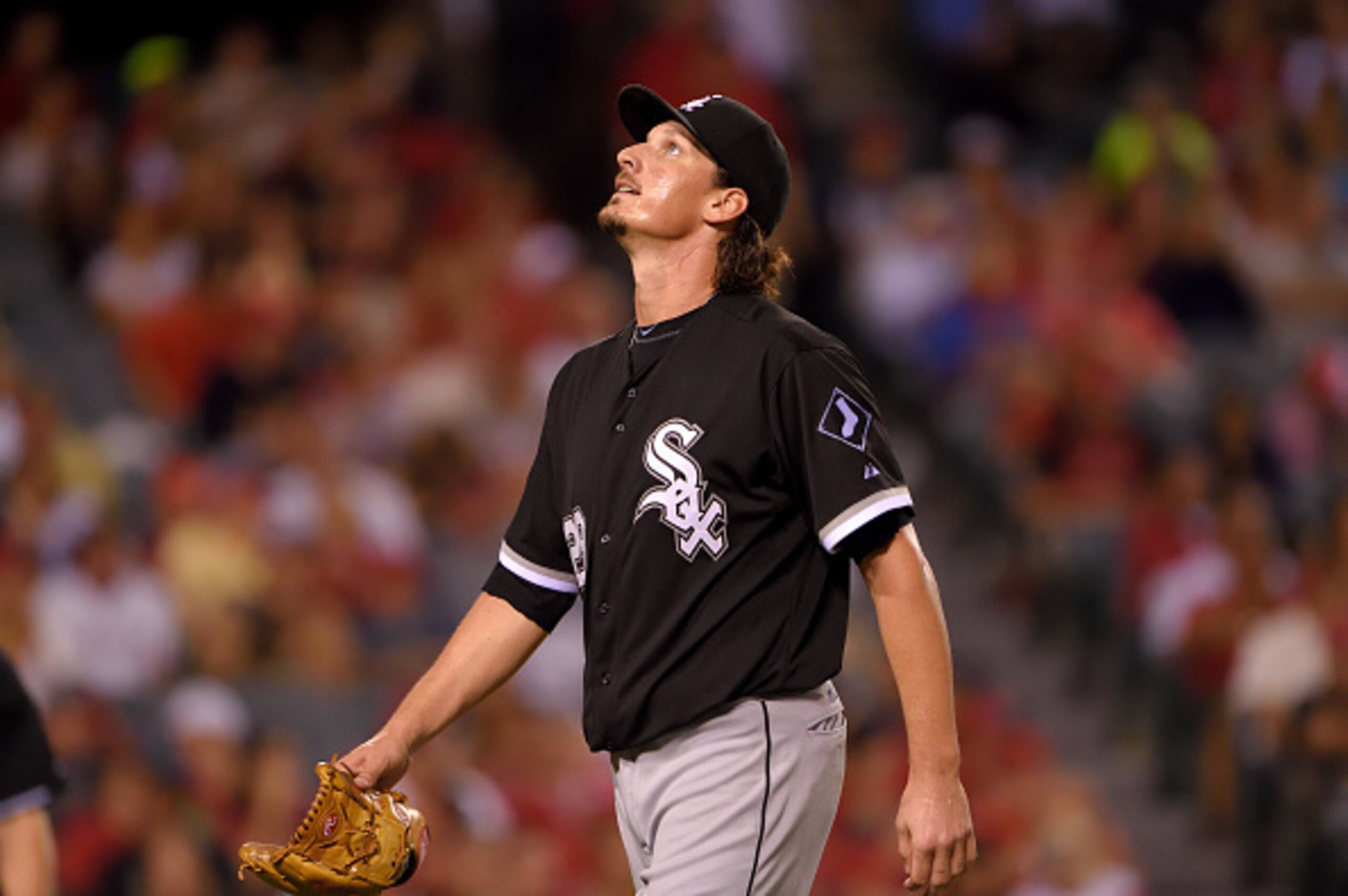 ANAHEIM, CA - AUGUST 19: Pitcher Jeff Samardzija #29 of the Chicago White Sox looks upward while reacting after allowing a solo home run as he heads to the dugout at the end of the seventh inning during the game against the Los Angeles Angels of Anaheim a