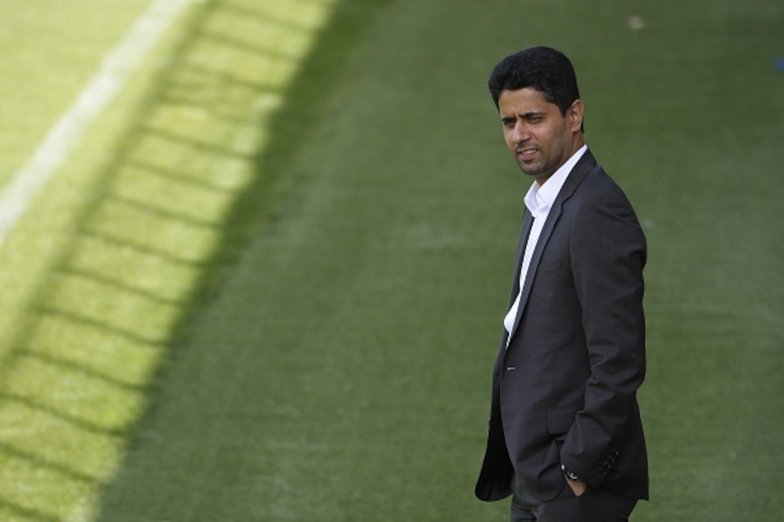 Paris Saint-Germain's Qatari President Nasser Al-Khelaifi stands on the pitch during a training session at the Camp des Loges training ground in Saint-Germain-en-Laye, west of Paris, on September 14, 2015, on the eve of the UEFA Champions League group A f Paris Saint-Germain's Qatari President Nasser Al-Khelaifi stands on the pitch during a training session at the Camp des Loges training ground in Saint-Germain-en-Laye, west of Paris, on September 14, 2015, on the eve of the UEFA Champions League group A f