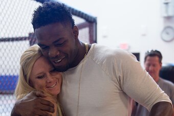 ALBUQUERQUE, NM - OCTOBER 31:  (R-L) Jon Jones hugs Holly Holm during the Jackson Wink MMA Academy Grand Opening at Jackson's Mixed Martial Arts & Fitness on October 31, 2015 in Albuquerque, New Mexico. (Photo by Brandon Magnus/Zuffa LLC/Zuffa LLC via Get