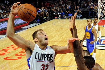 LOS ANGELES CA - OCTOBER 20: Blake Griffin #32 of the Los Angeles Clippers goes up for a shot against Festus Ezeli #31 of the Golden State Warriors during the first quarter of the pre-season basketball game at Staples Center October 20, 2015 in Los Angele