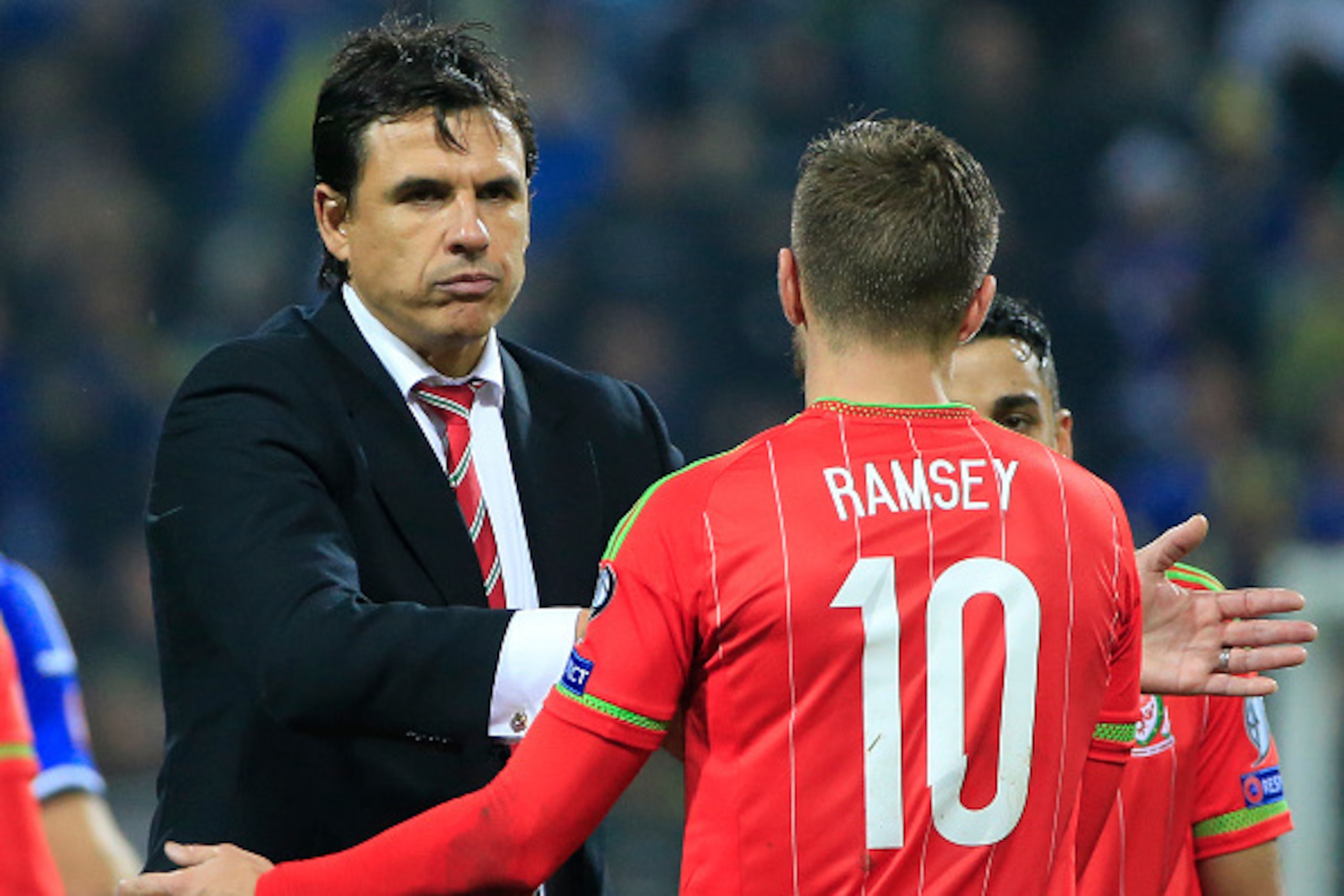 ZENICA, BOSNIA AND HERZEGOVINA - OCTOBER 10: Head coach Chris Coleman (L) celebrate with the Aaron Ramsey (R) of Wales after the Euro 2016 qualifying football match between Bosnia and Herzegovina and Wales at the Stadium Bilino Polje in Elbasan on October ZENICA, BOSNIA AND HERZEGOVINA - OCTOBER 10: Head coach Chris Coleman (L) celebrate with the Aaron Ramsey (R) of Wales after the Euro 2016 qualifying football match between Bosnia and Herzegovina and Wales at the Stadium Bilino Polje in Elbasan on October